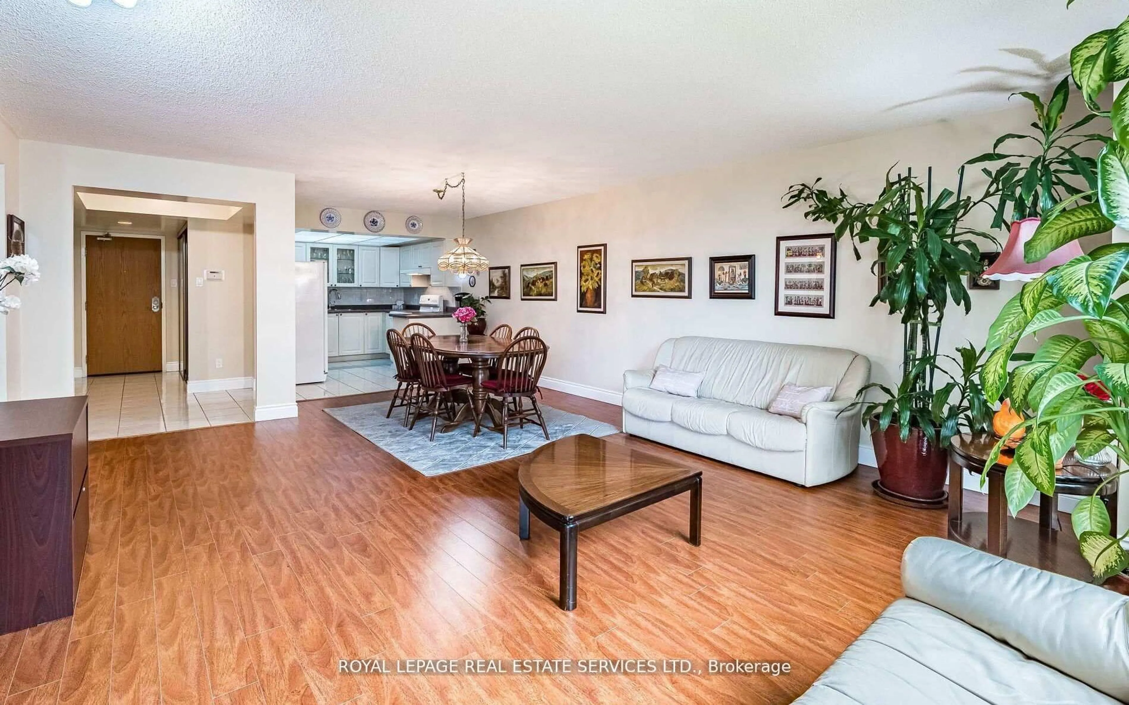 Living room with furniture, wood/laminate floor for 310 Mill St #202, Brampton Ontario L6Y 3B1