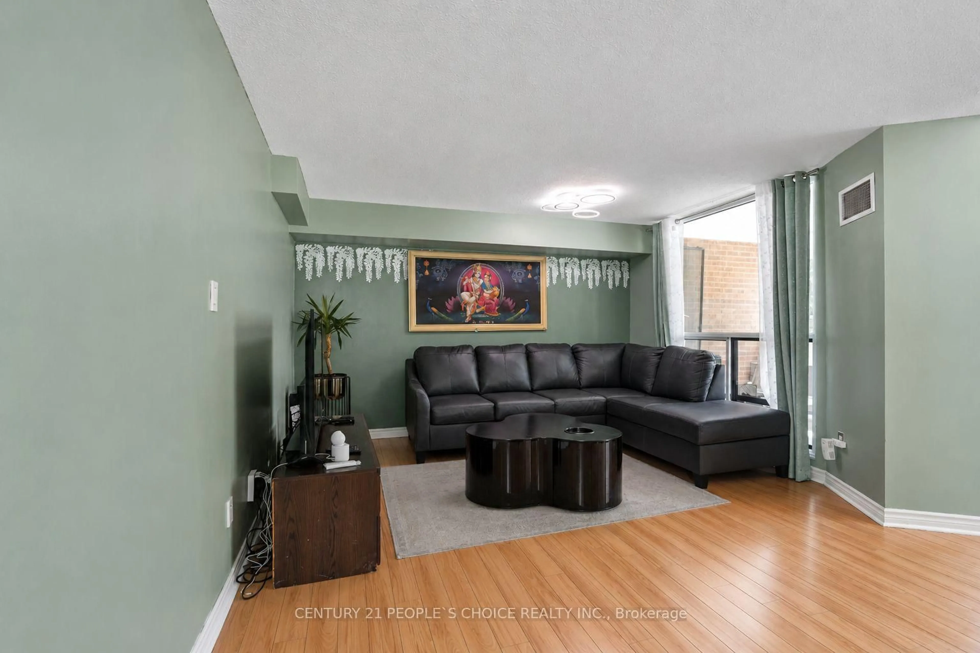 Living room with furniture, wood/laminate floor for 1580 Mississauga Valley Blvd #207, Mississauga Ontario L5A 3T8