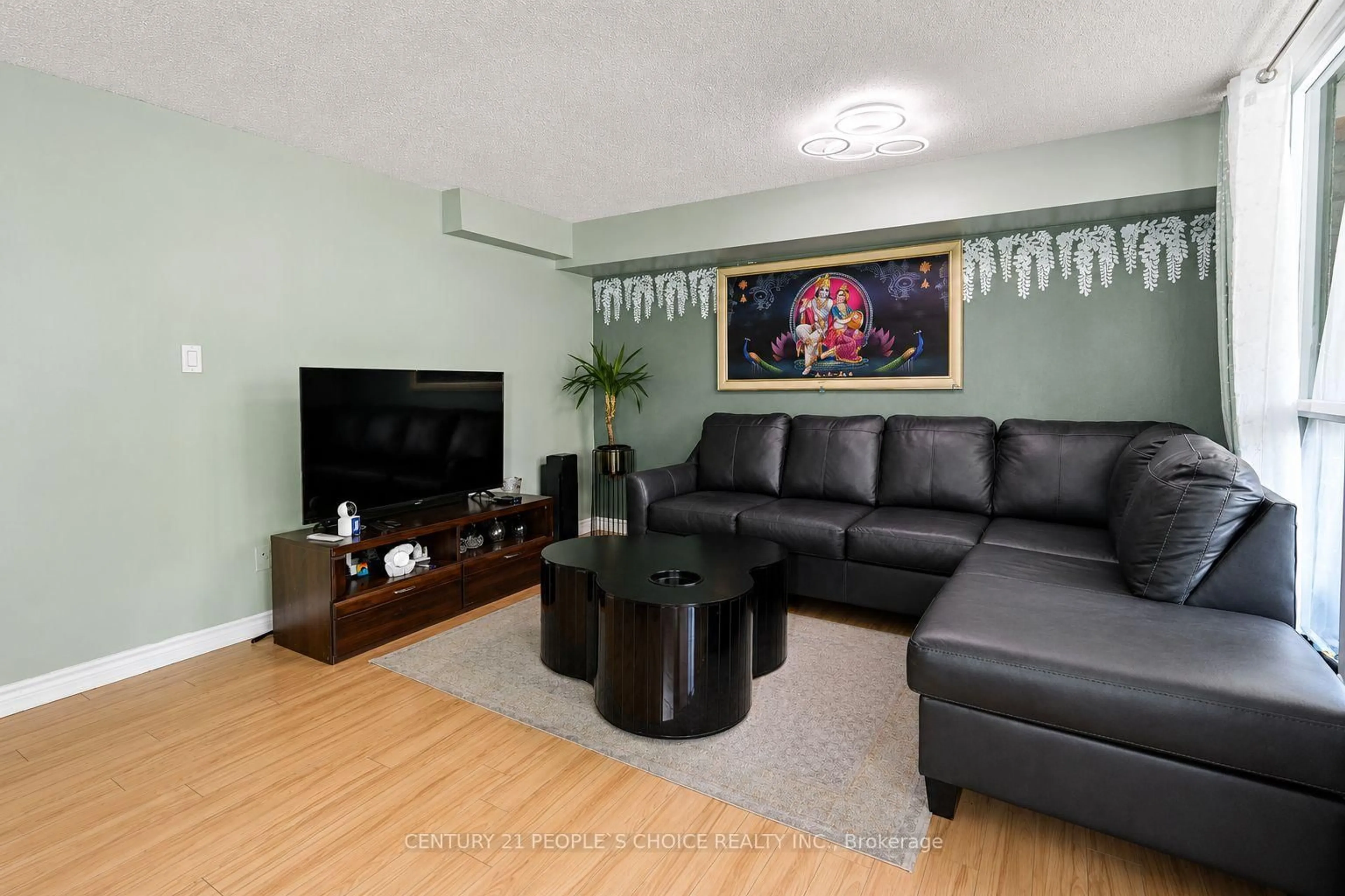 Living room with furniture, wood/laminate floor for 1580 Mississauga Valley Blvd #207, Mississauga Ontario L5A 3T8