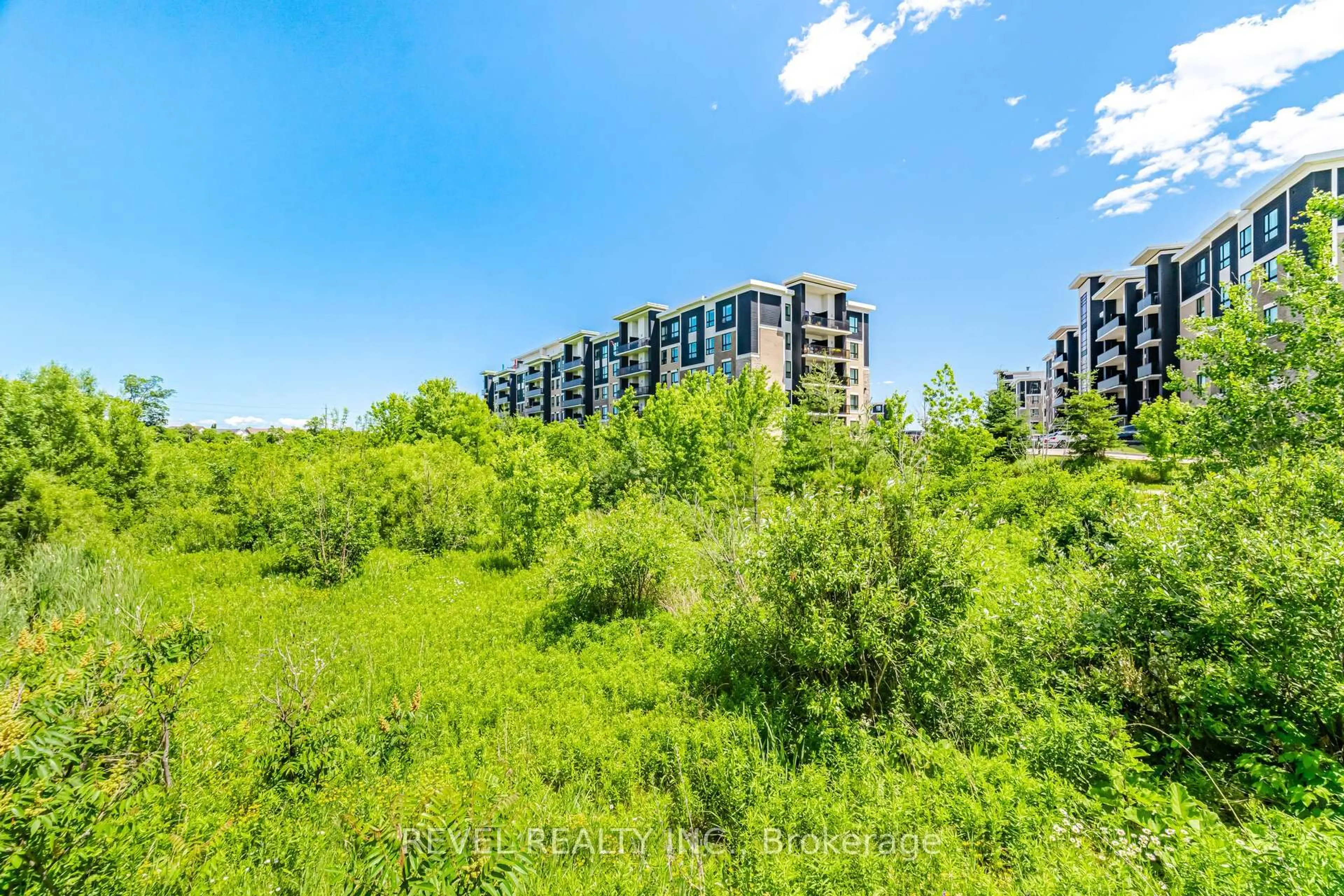 A pic from outside/outdoor area/front of a property/back of a property/a pic from drone, forest/trees view for 630 Sauve St #220, Milton Ontario L9T 9A6