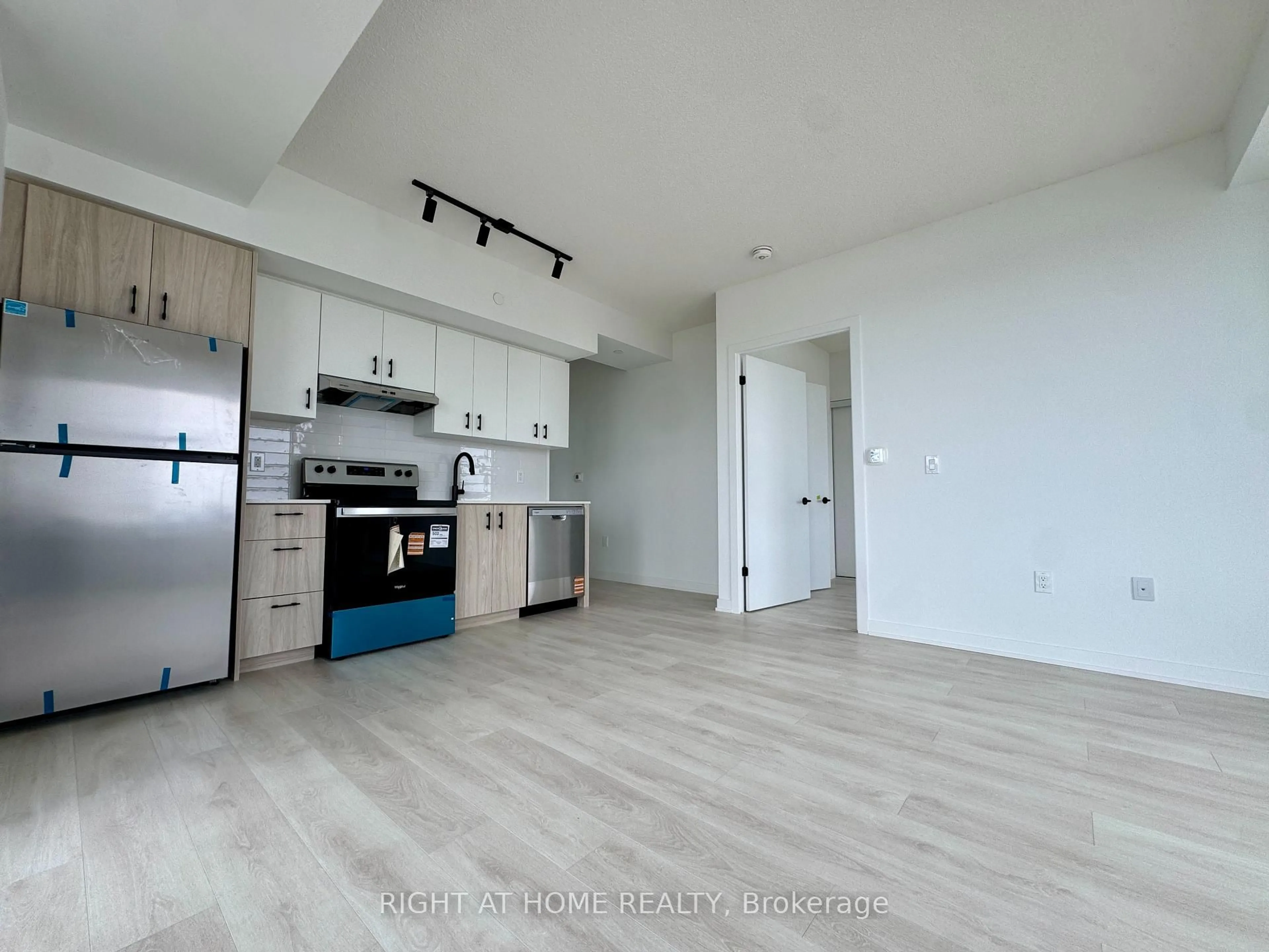 Open concept kitchen, wood/laminate floor for 4878 Powers Common #D1209, Burlington Ontario L7M 2B4