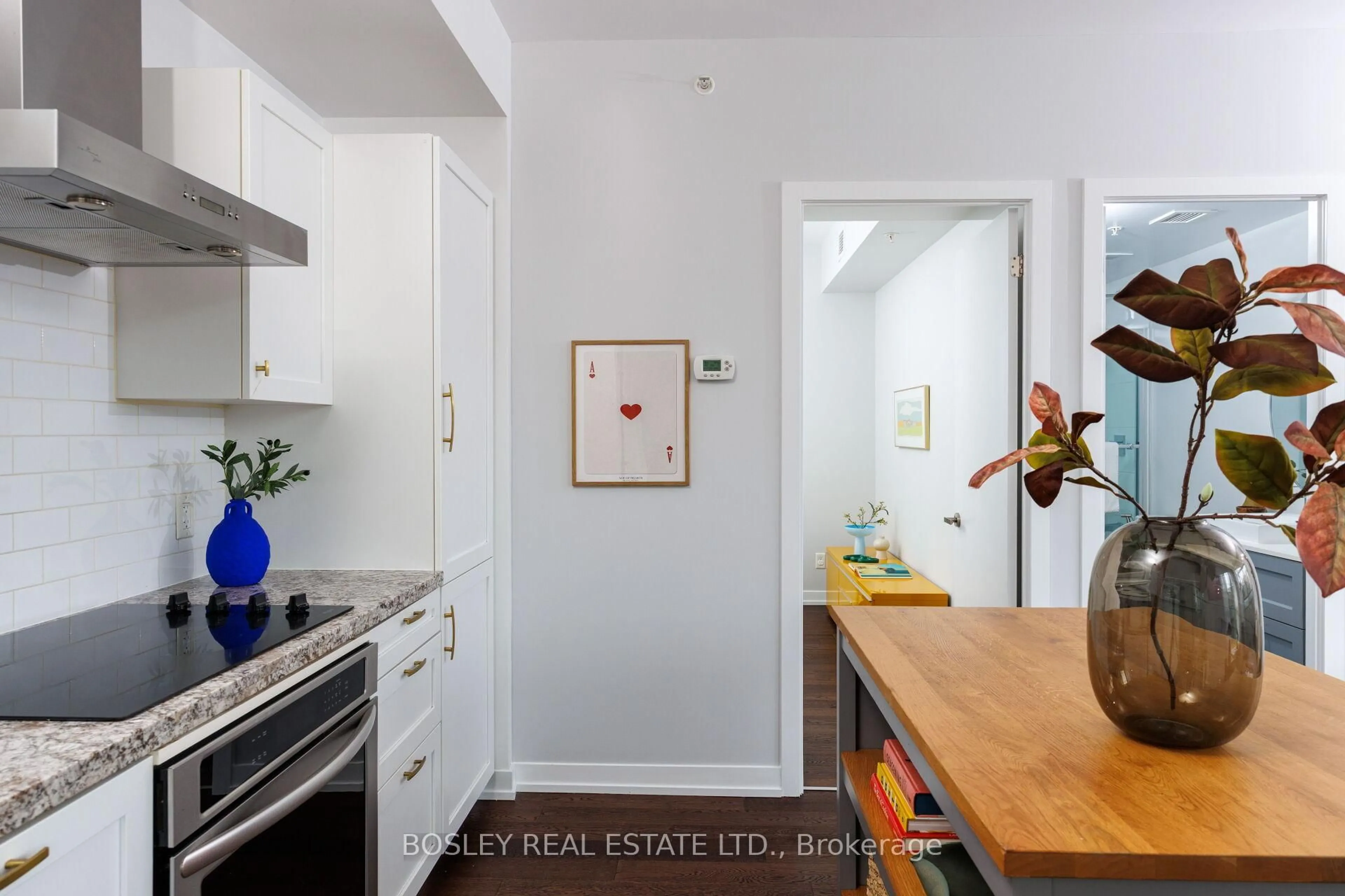 Open concept kitchen, wood/laminate floor for 36 Howard Park Ave #209, Toronto Ontario M6R 0A5