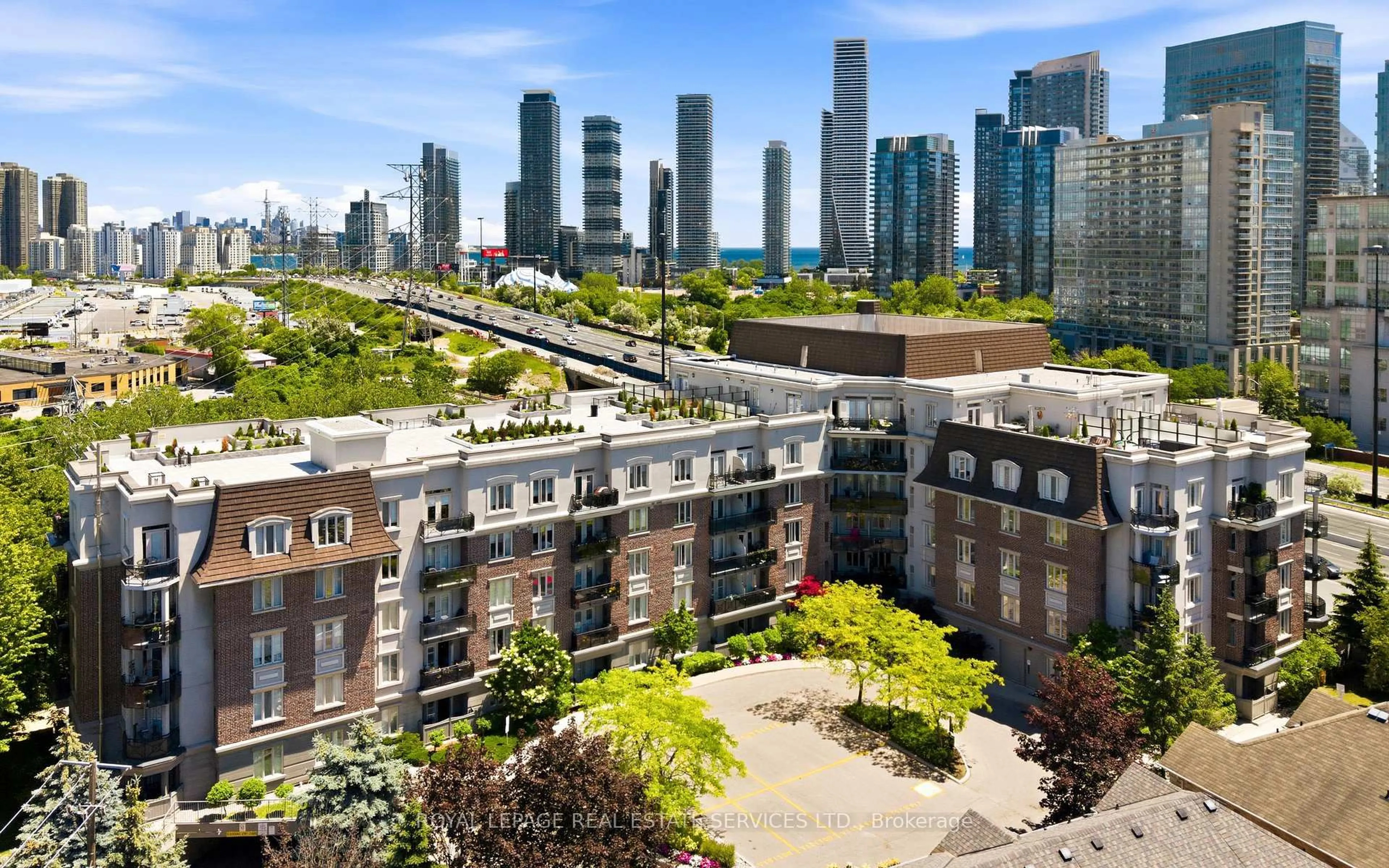 A pic from outside/outdoor area/front of a property/back of a property/a pic from drone, city buildings view from balcony for 245 Dalesford Rd #114, Toronto Ontario M8Y 4H7