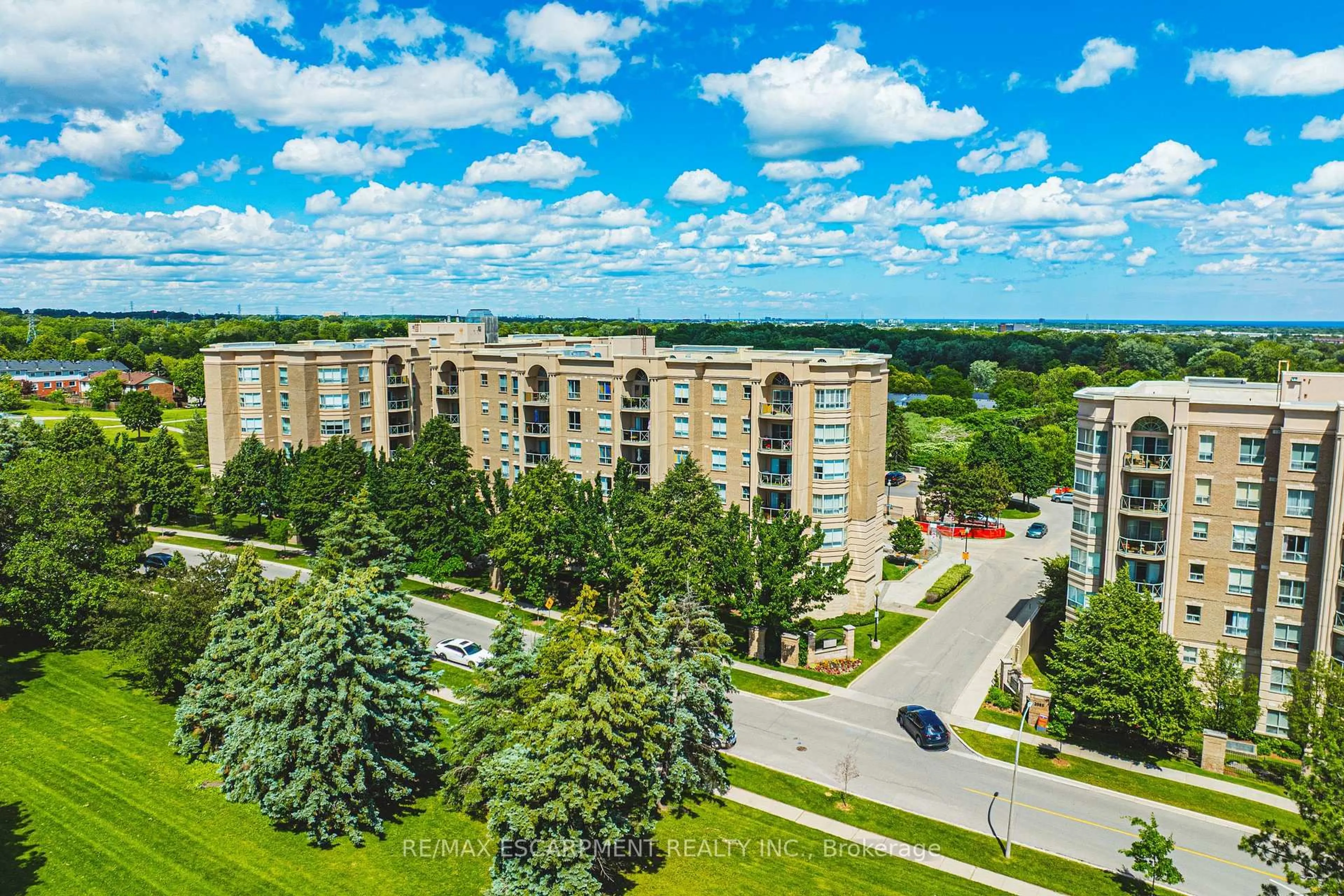 A pic from outside/outdoor area/front of a property/back of a property/a pic from drone, city buildings view from balcony for 2075 Amherst Heights Dr #103, Burlington Ontario L7P 5B8