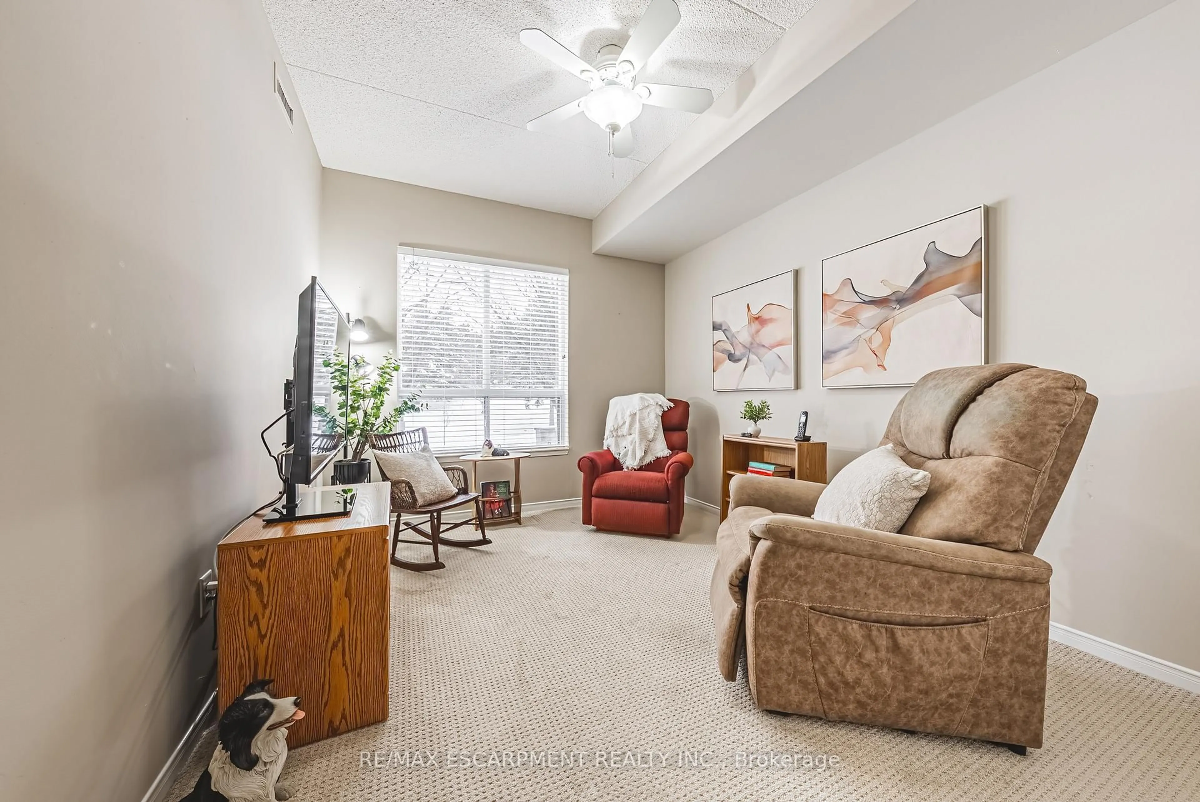 Living room with furniture, carpet floor for 2075 Amherst Heights Dr #103, Burlington Ontario L7P 5B8