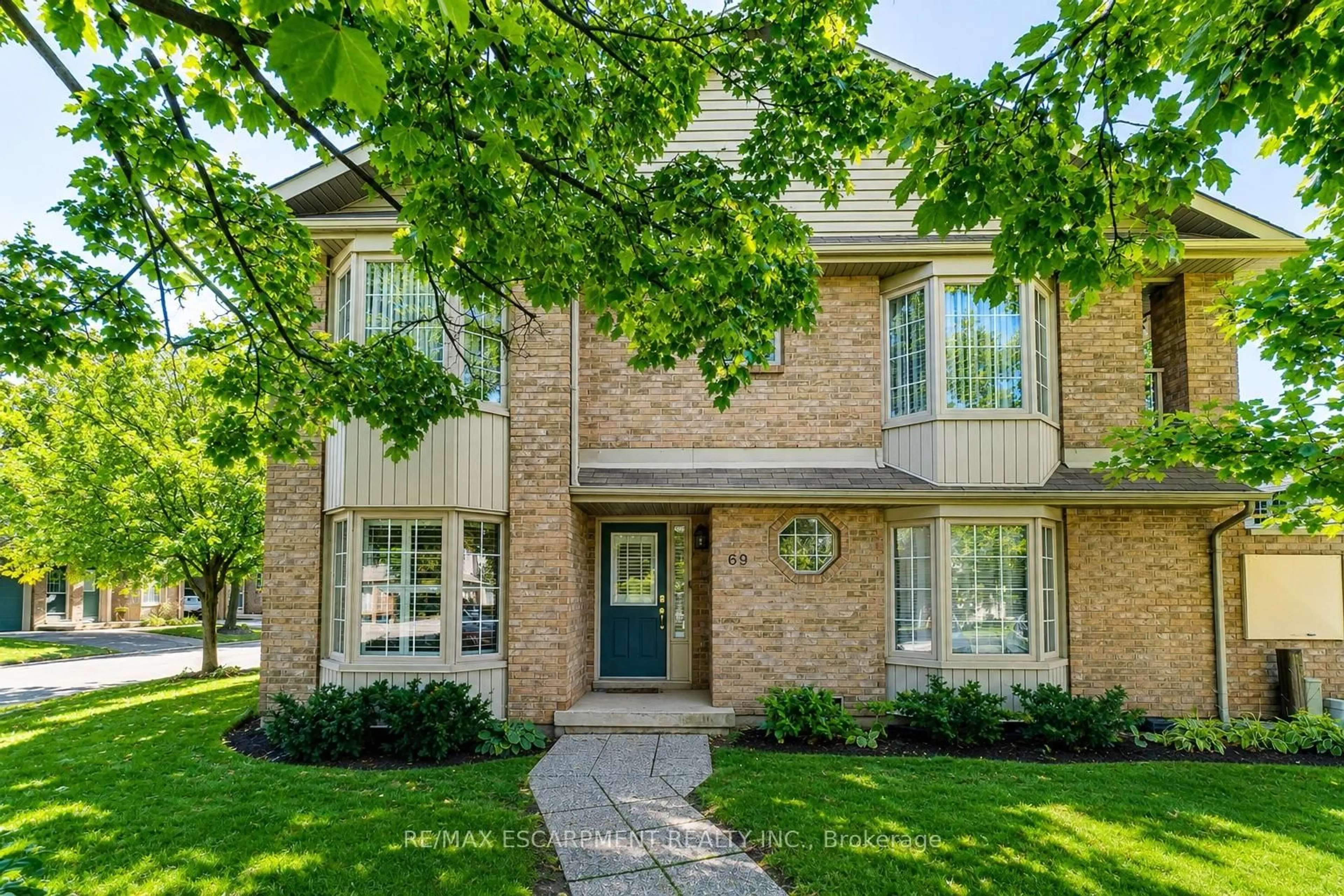 Home with brick exterior material, street for 3333 New St #69, Burlington Ontario L7N 1N1