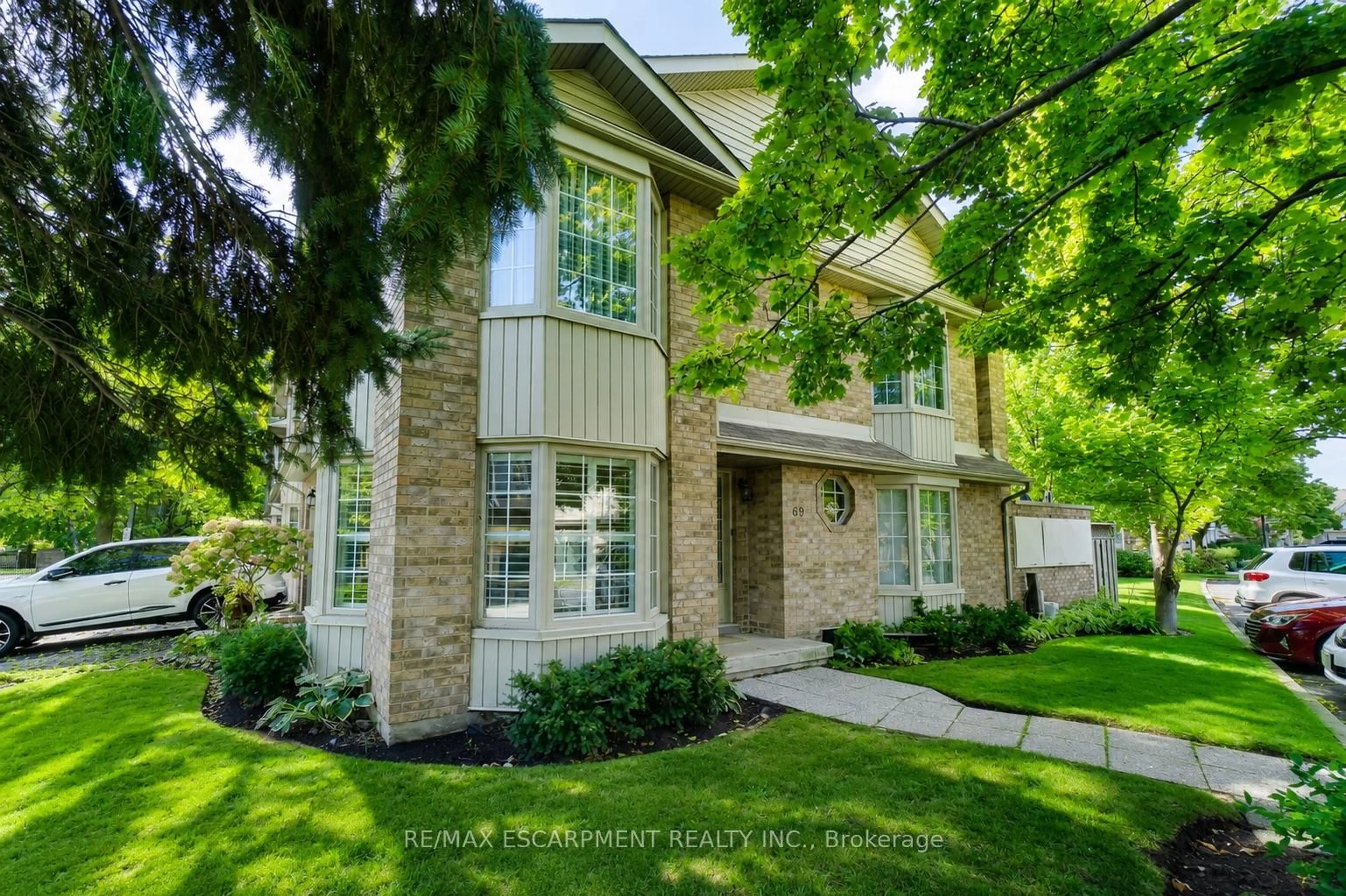 Home with brick exterior material, street for 3333 New St #69, Burlington Ontario L7N 1N1