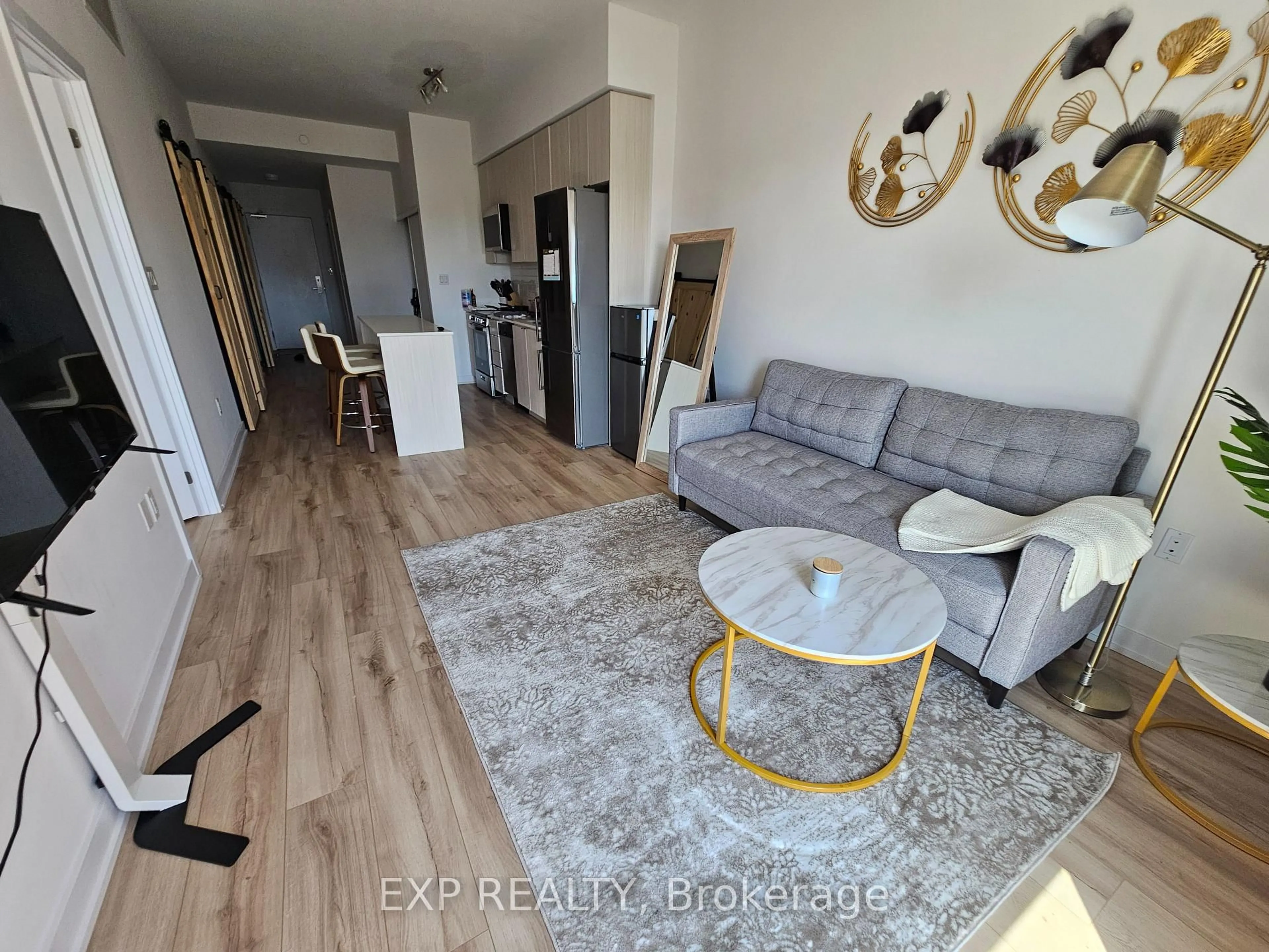 Living room with furniture, wood/laminate floor for 2433 Dufferin St #703, Toronto Ontario M6E 0B4
