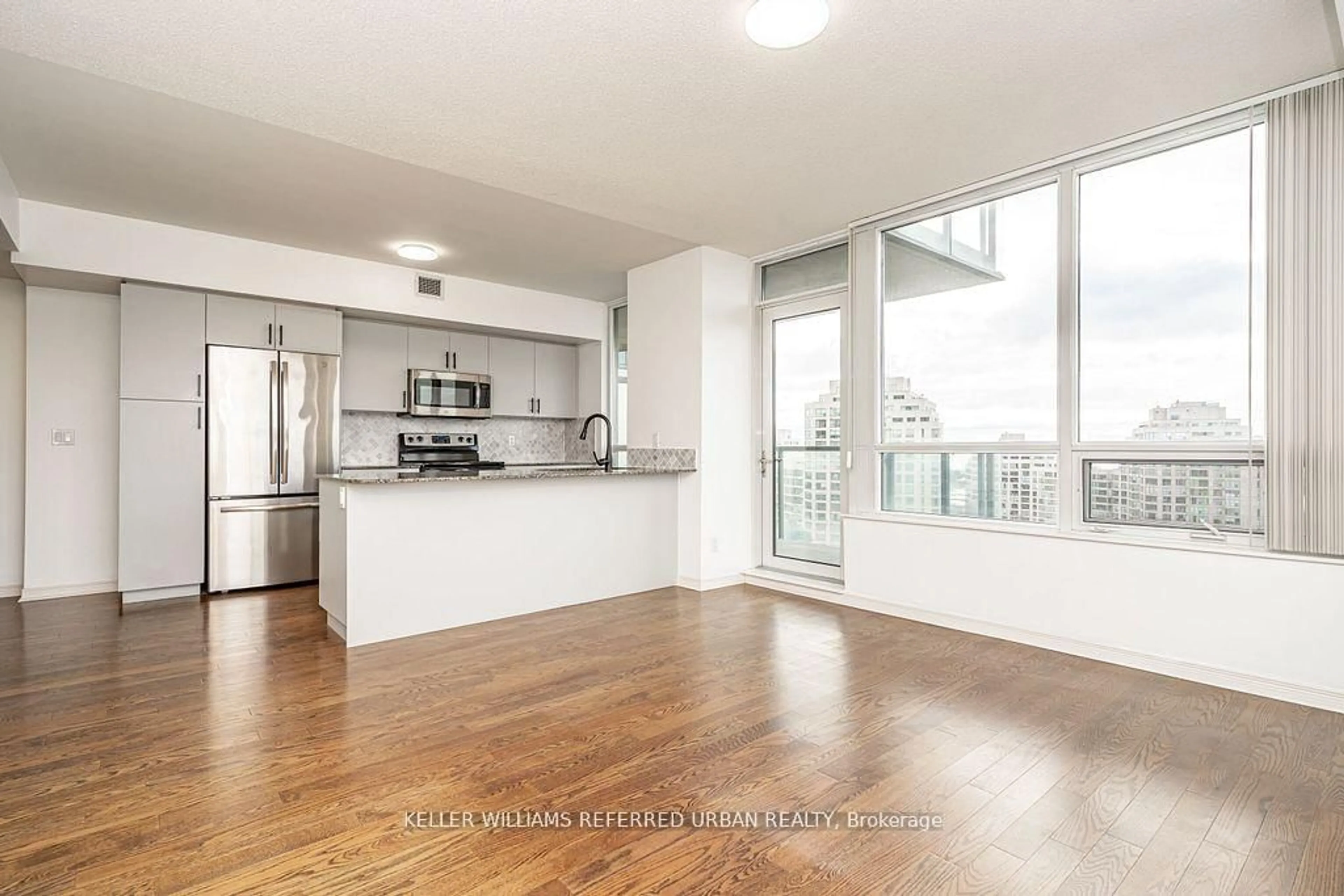 Open concept kitchen, wood/laminate floor for 15 Legion Rd #1002, Toronto Ontario M8V 0A9