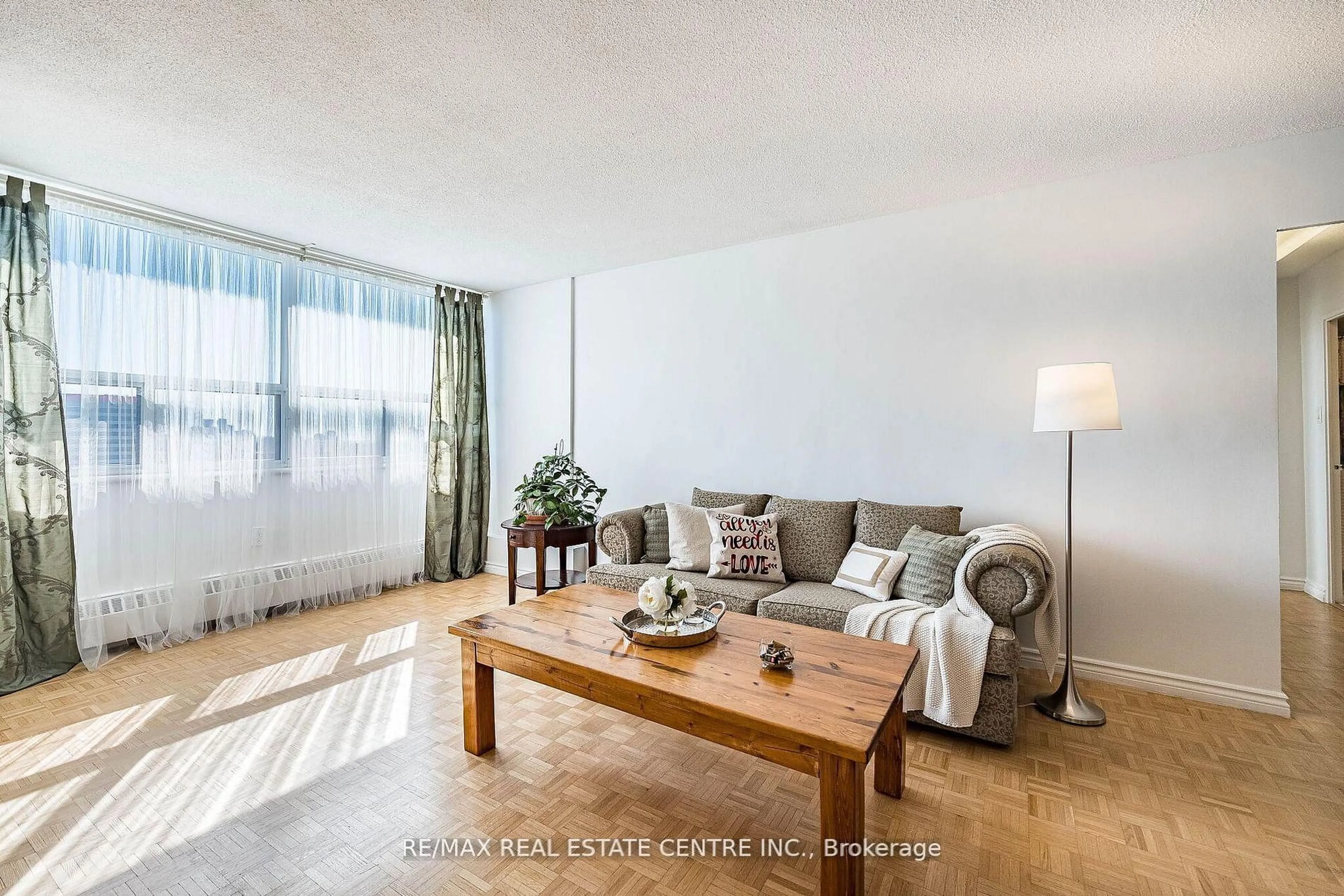 Living room with furniture, wood/laminate floor for 451 The West Mall Dr #1502, Toronto Ontario M9C 1G1