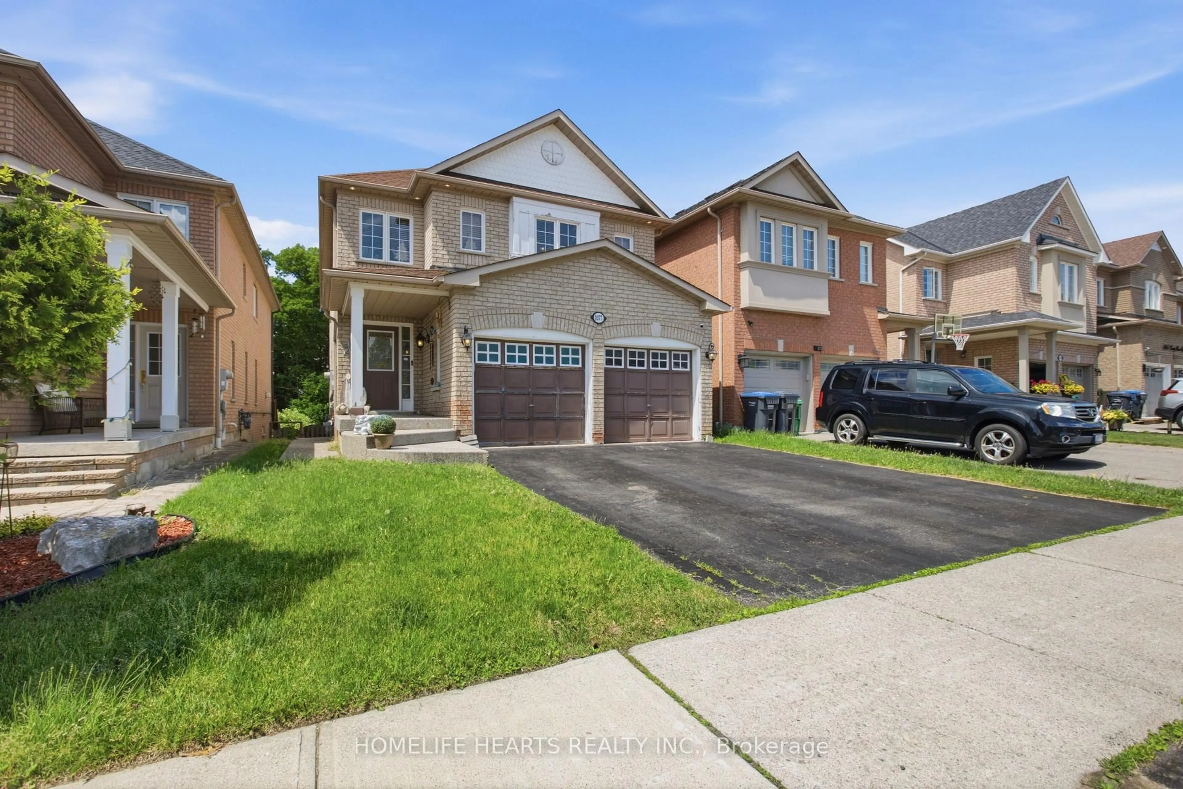 Home with brick exterior material, street for 1077 Knotty Pine Grve, Mississauga Ontario L5W 1J6