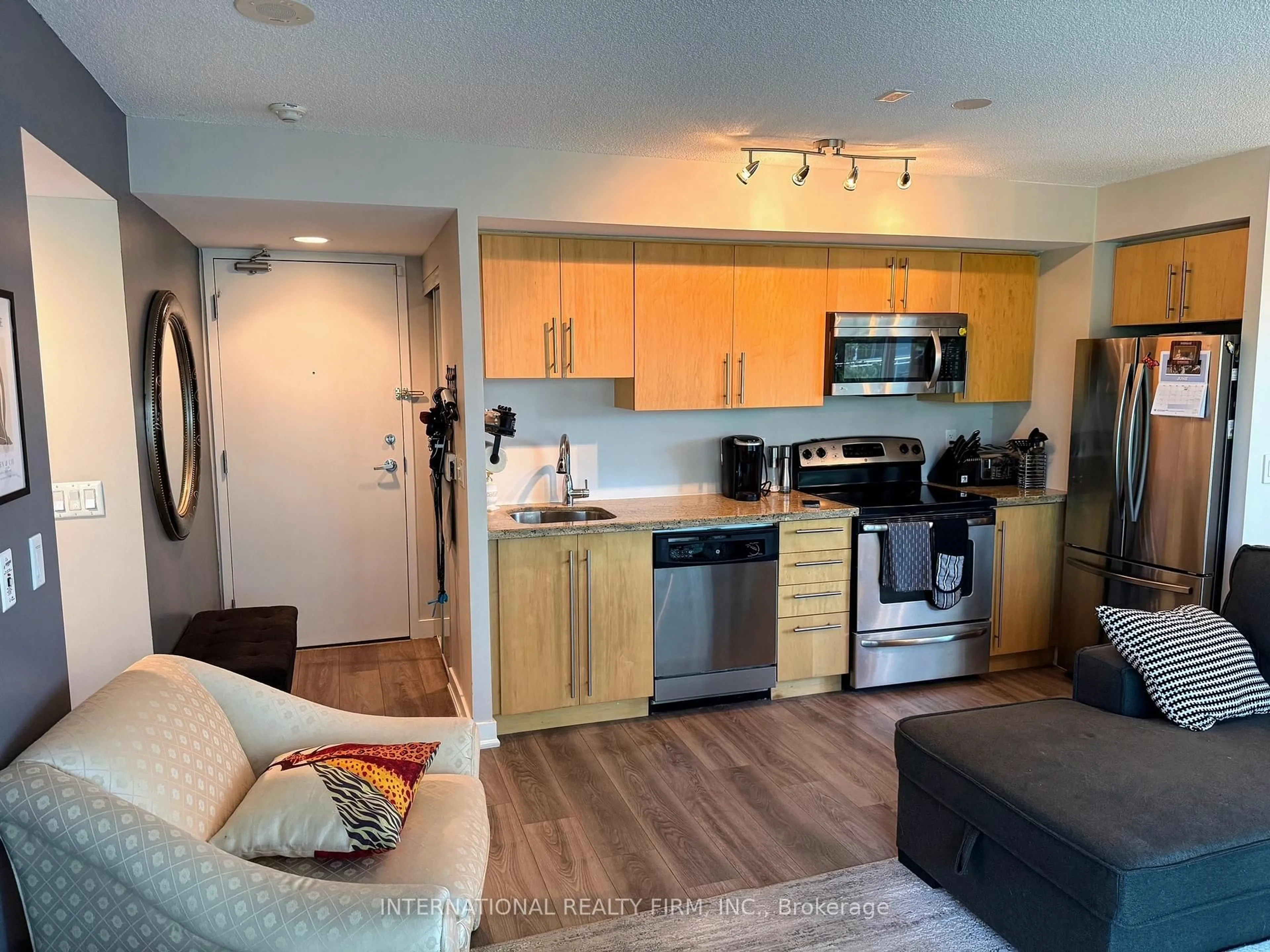 Open concept kitchen, wood/laminate floor for 155 Legion Rd #513, Toronto Ontario M8Y 0A7