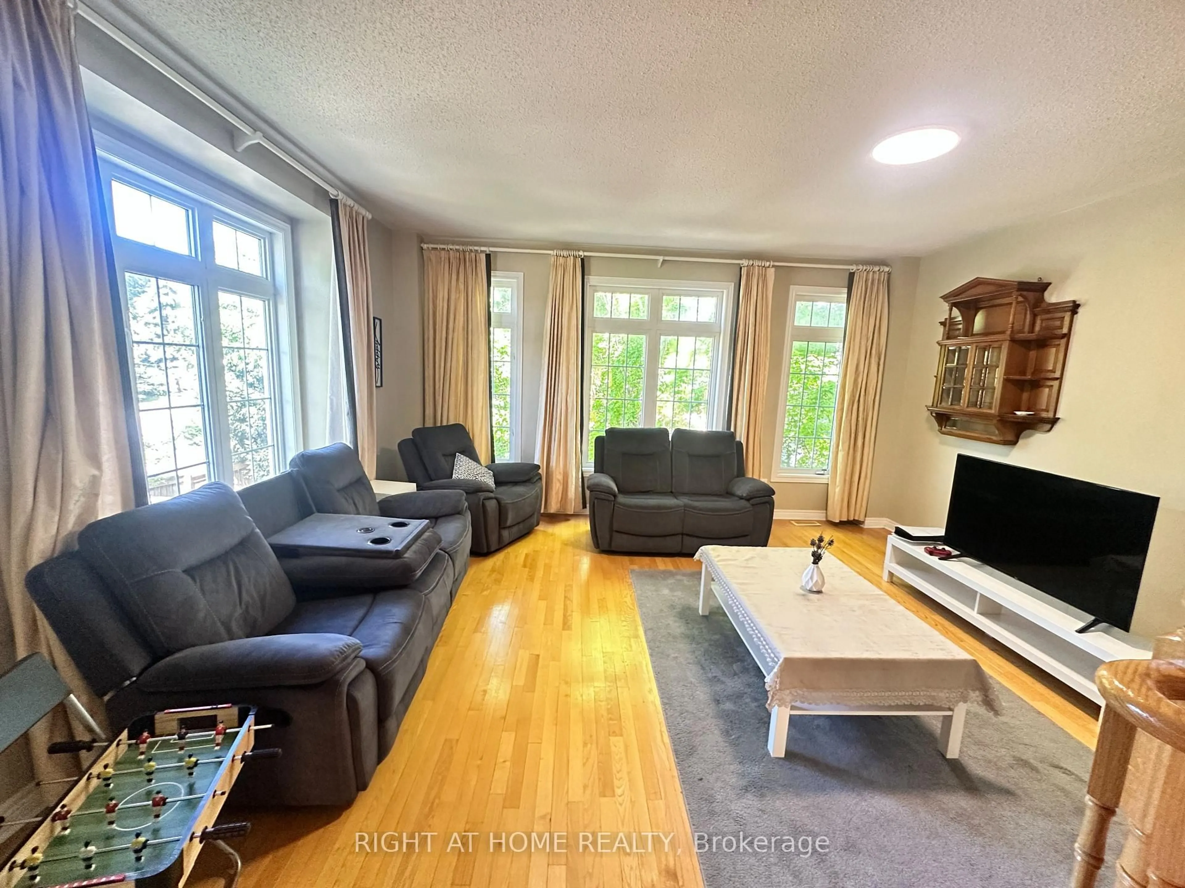 Living room with furniture, wood/laminate floor for 485 Bristol Rd #12, Mississauga Ontario L5R 4G2