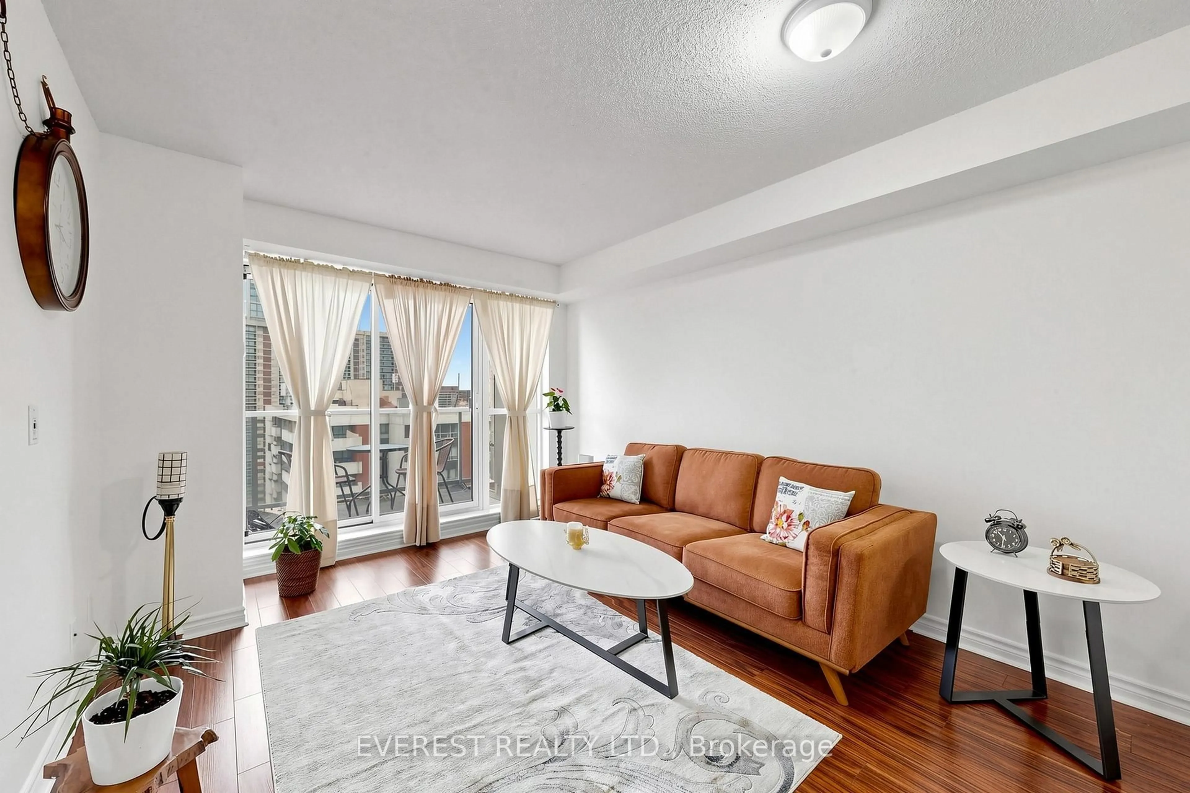 Living room with furniture, wood/laminate floor for 5 Michael Power Pl ##2101, Toronto Ontario M9A 0A3