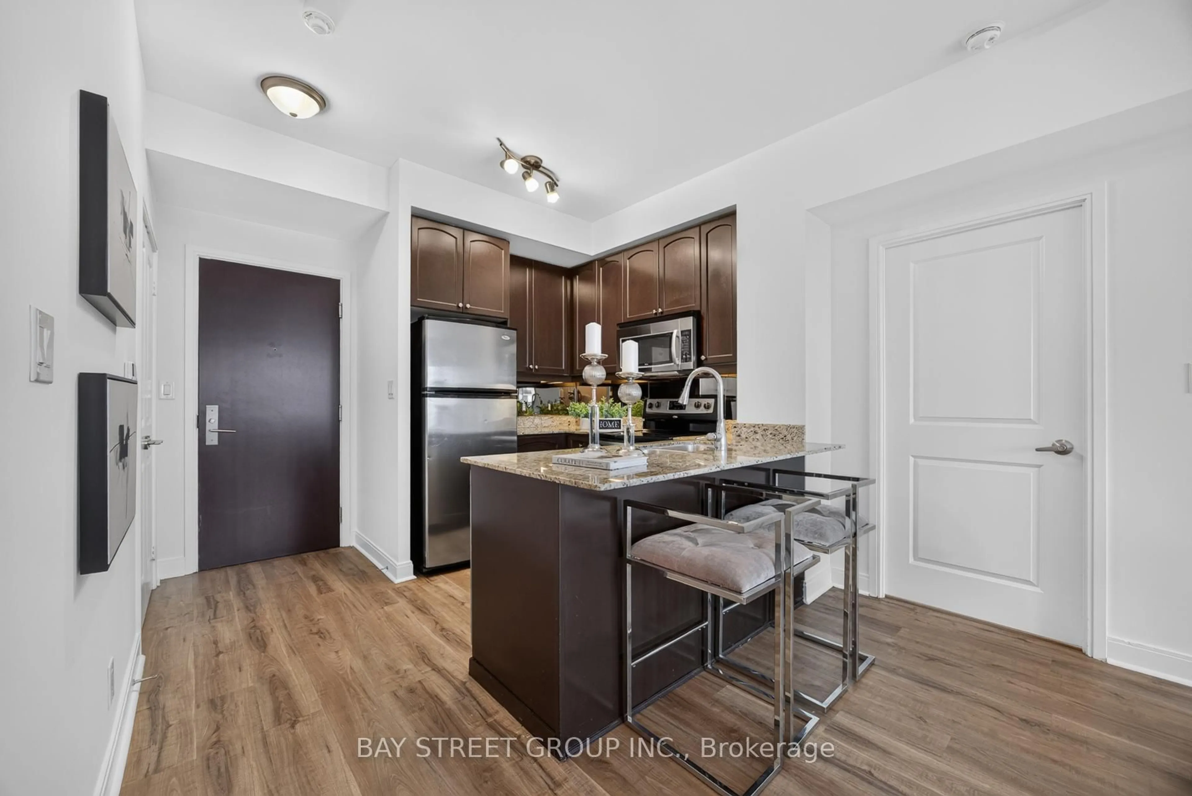 Open concept kitchen, wood/laminate floor for 50 Absolute Ave #1302, Mississauga Ontario L4Z 0A9