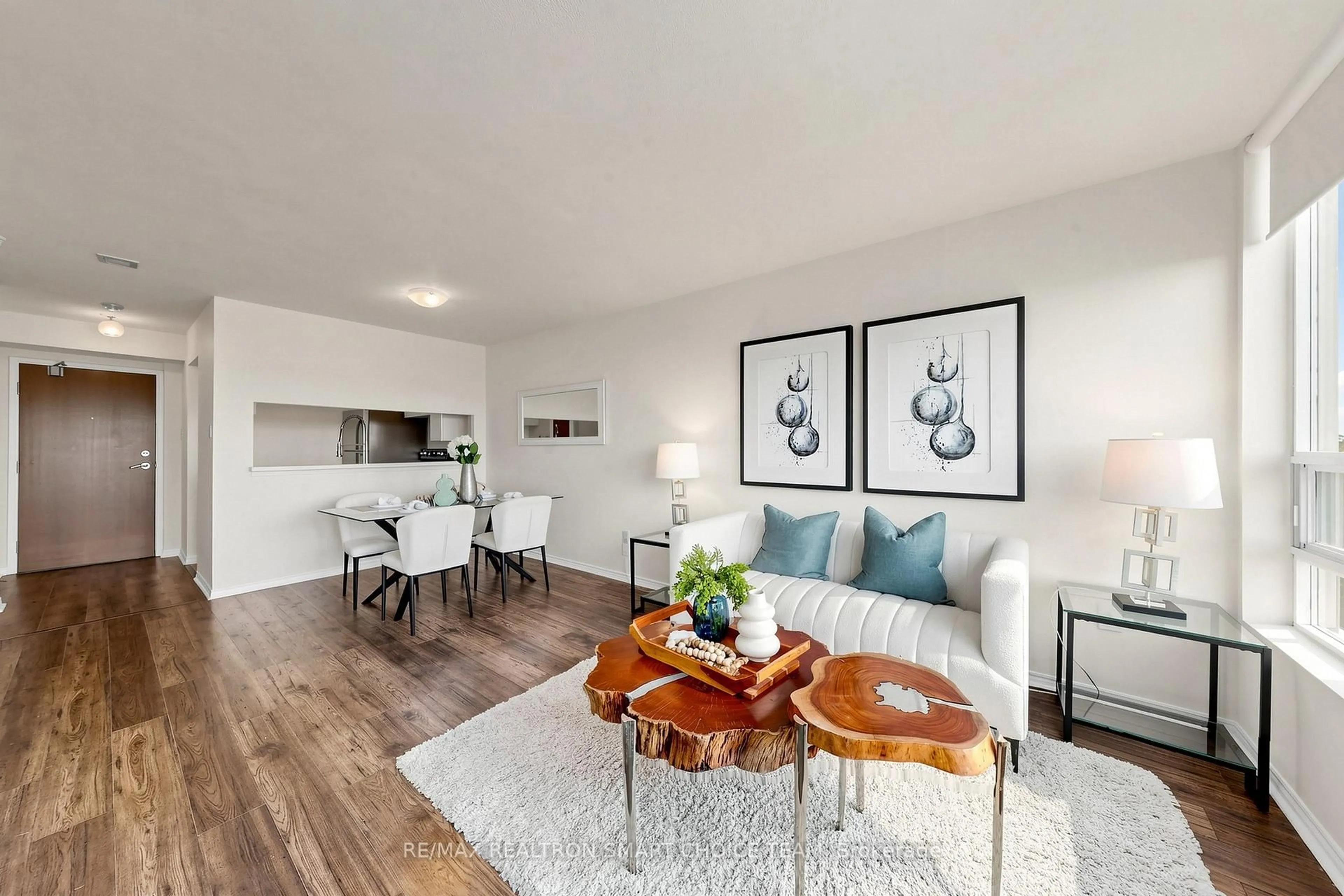 Living room with furniture, wood/laminate floor for 50 Kingsbridge Garden Circ #504, Mississauga Ontario L5R 1Y2