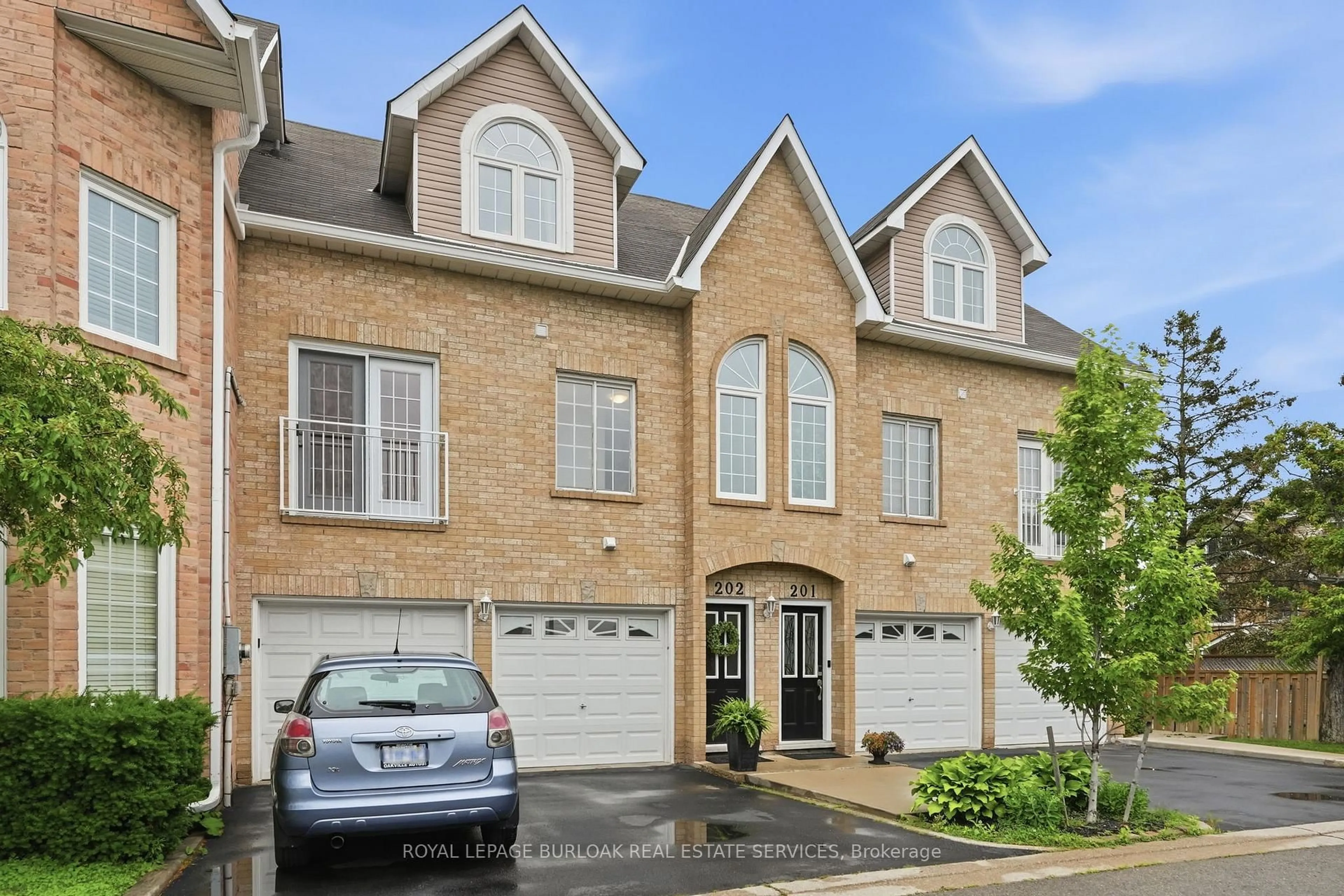 Home with brick exterior material, street for 2055 Walkers Line #202, Burlington Ontario L7M 4B5
