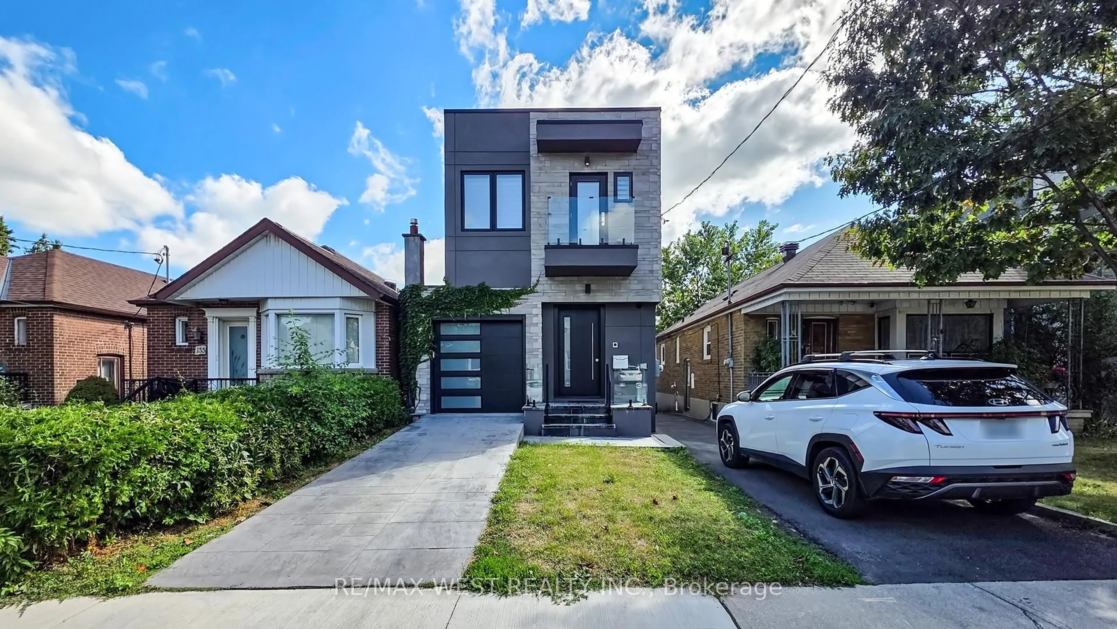 Home with brick exterior material, street for 133 Times Rd, Toronto Ontario M6B 3M3