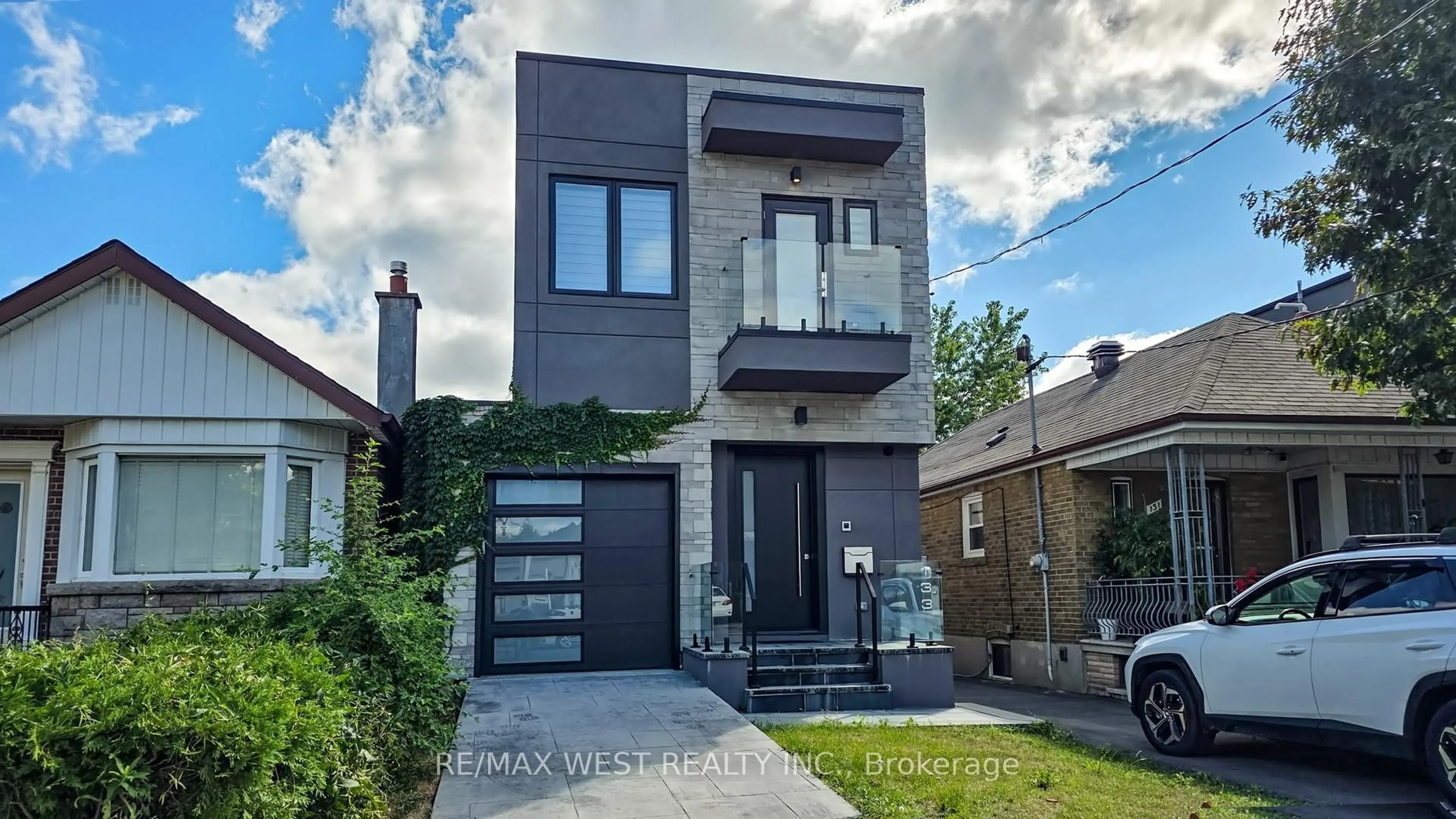 Home with brick exterior material, street for 133 Times Rd, Toronto Ontario M6B 3M3