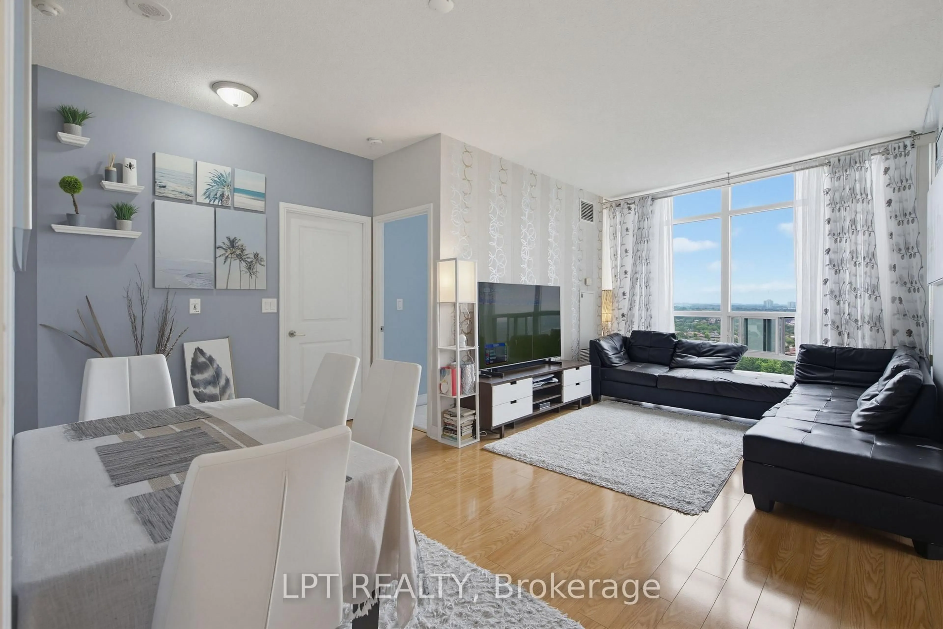 Living room with furniture, wood/laminate floor for 80 Absolute Ave #1303, Mississauga Ontario L4Z 0A5