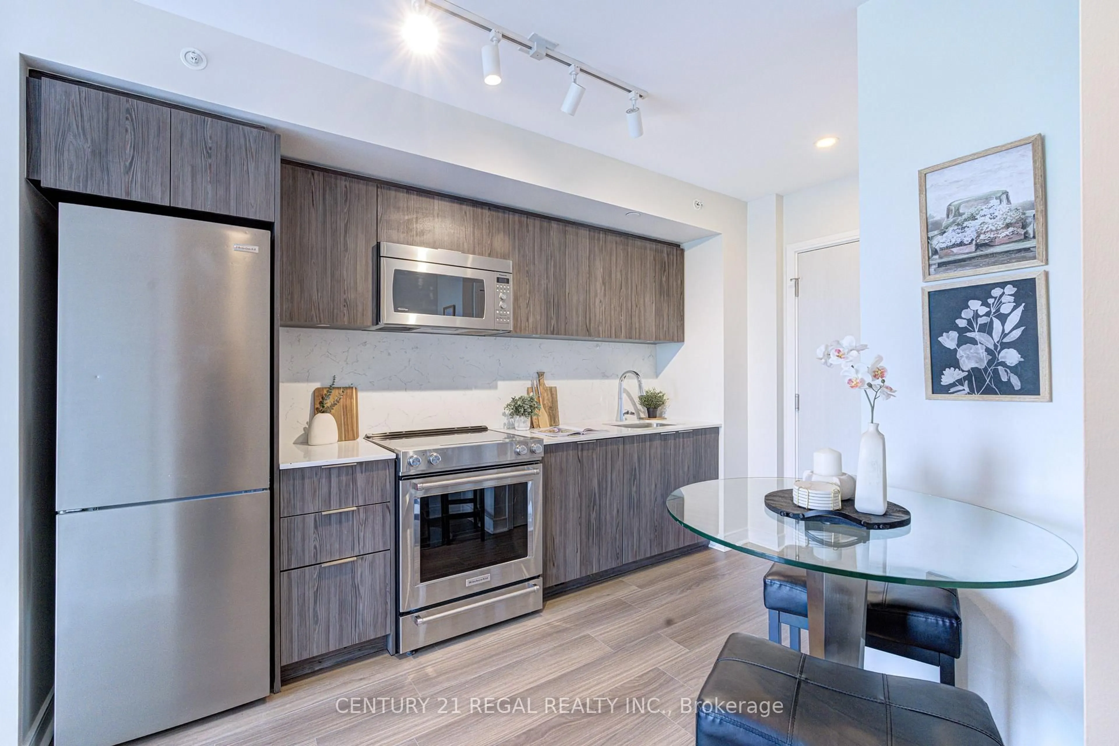 Open concept kitchen, wood/laminate floor for 30 Samuel Wood Way #412, Toronto Ontario M9B 0C9