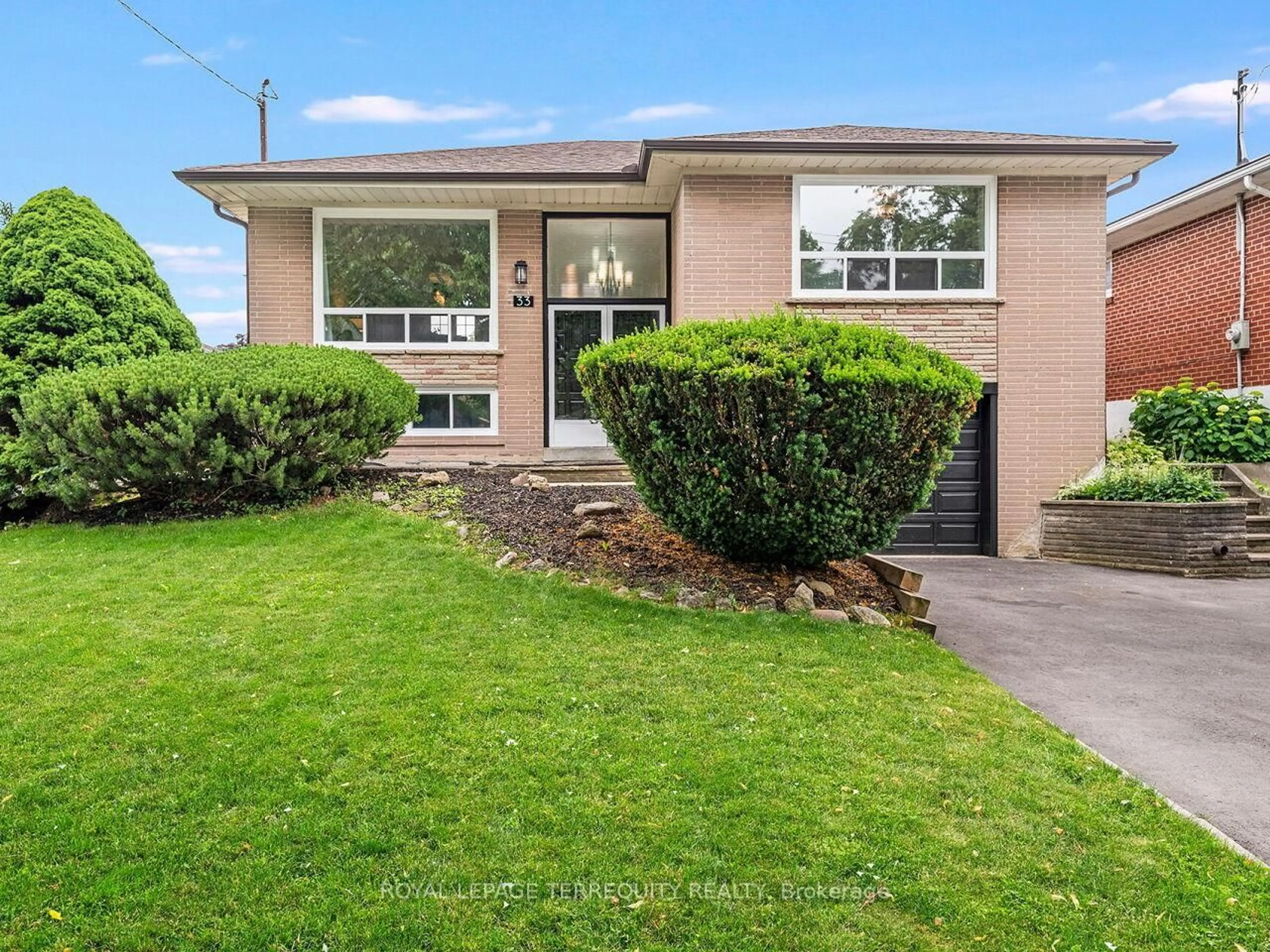 Home with brick exterior material, street for 33 Ludgate Dr, Toronto Ontario M9W 2Y2