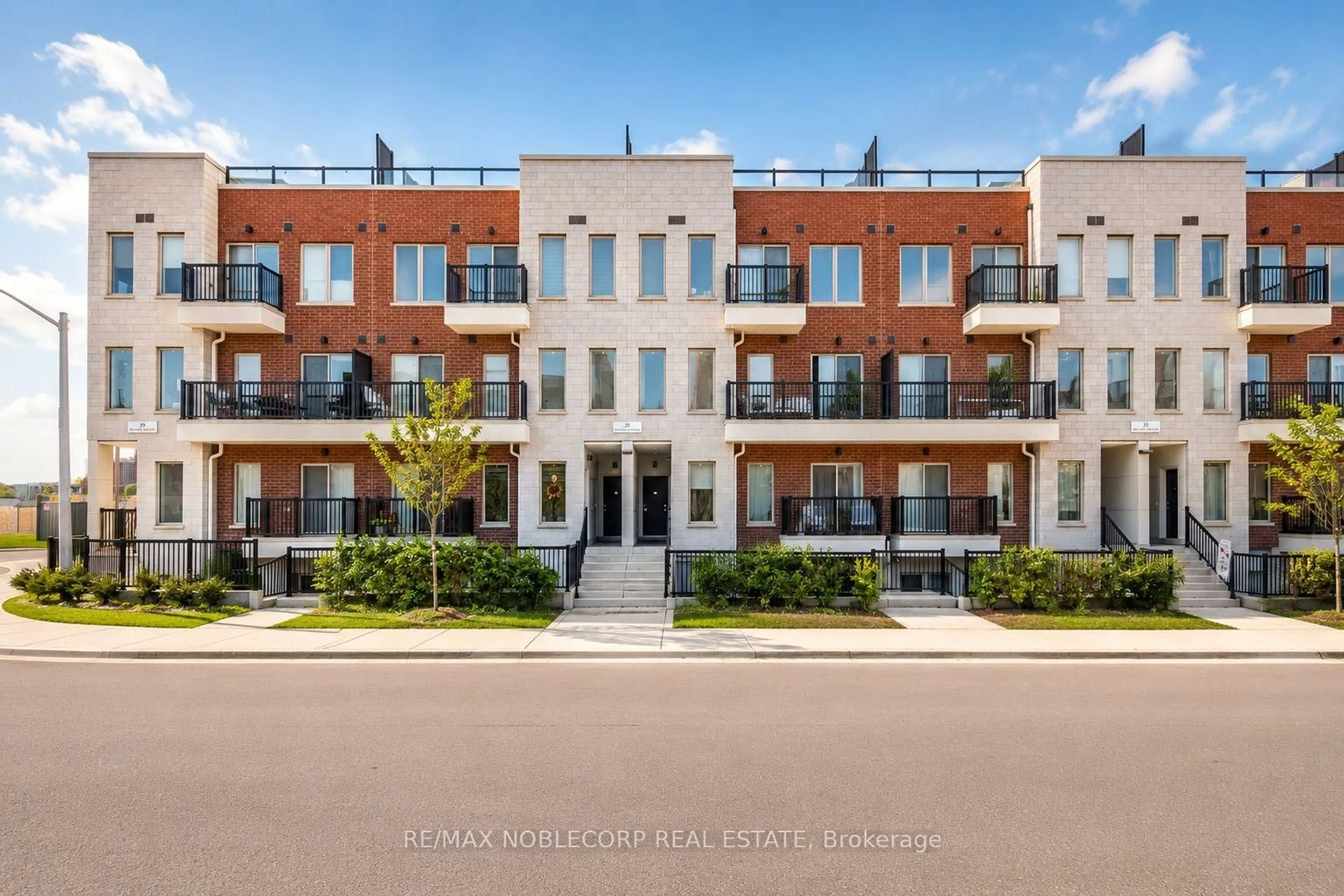 Home with brick exterior material, street for 39 John Perkins Bull Dr #22, Toronto Ontario M3K 0C3