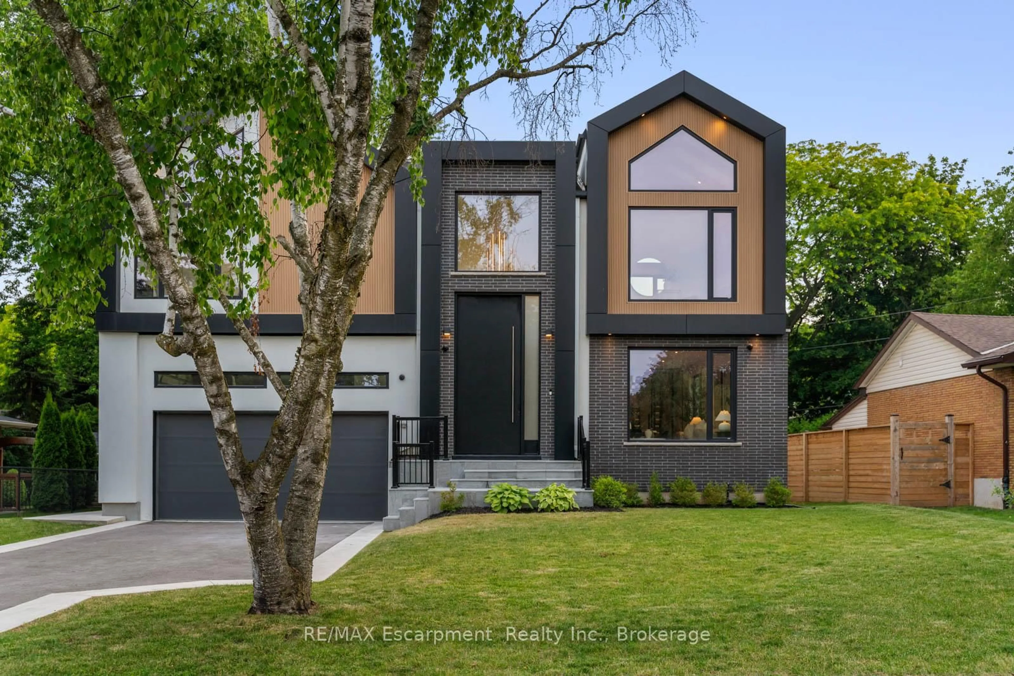 Home with brick exterior material, street for 298 Strathcona Dr, Burlington Ontario L7L 2E1