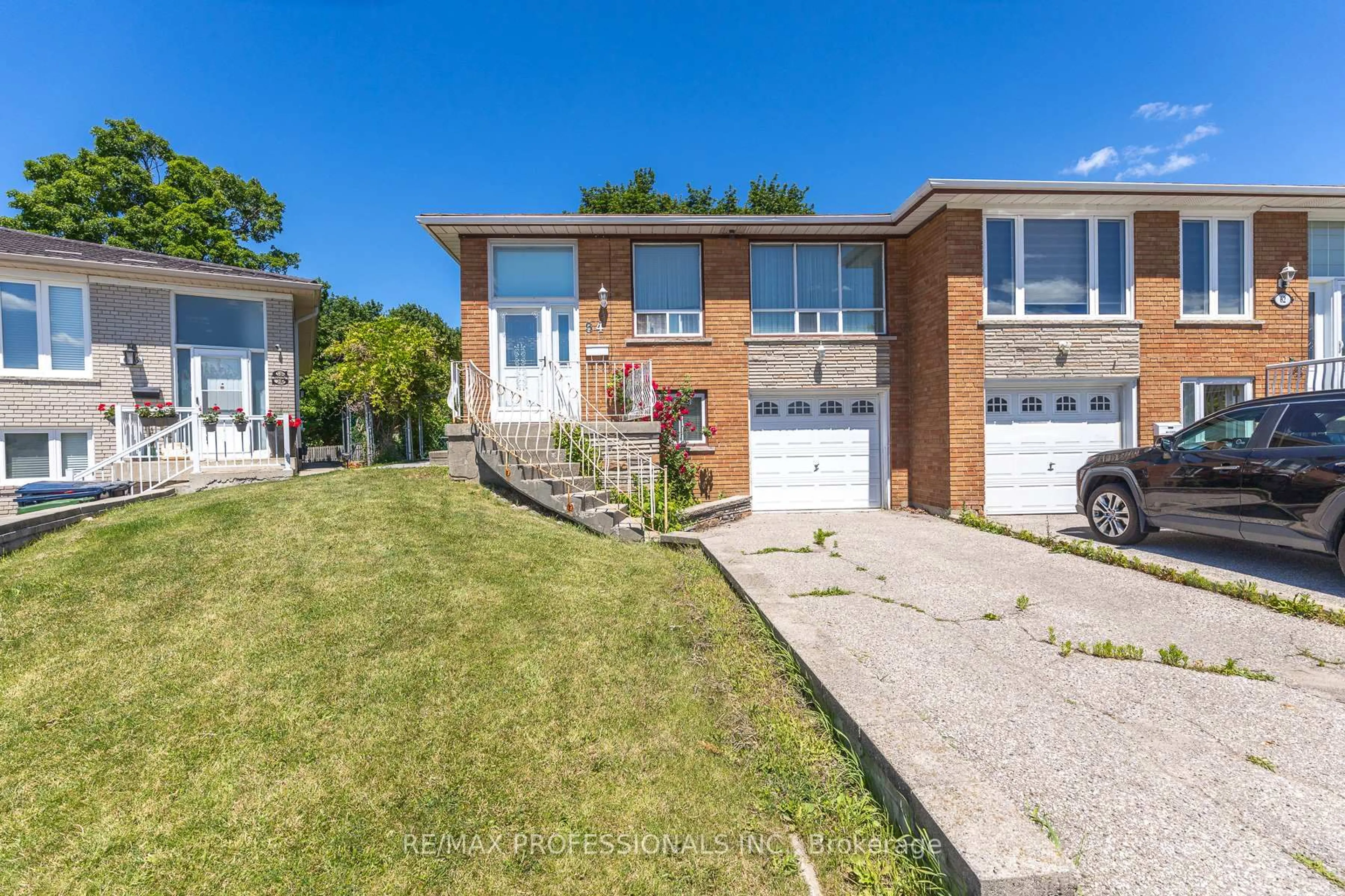 Home with brick exterior material, street for 64 Ikley Rd, Toronto Ontario M3J 1C6