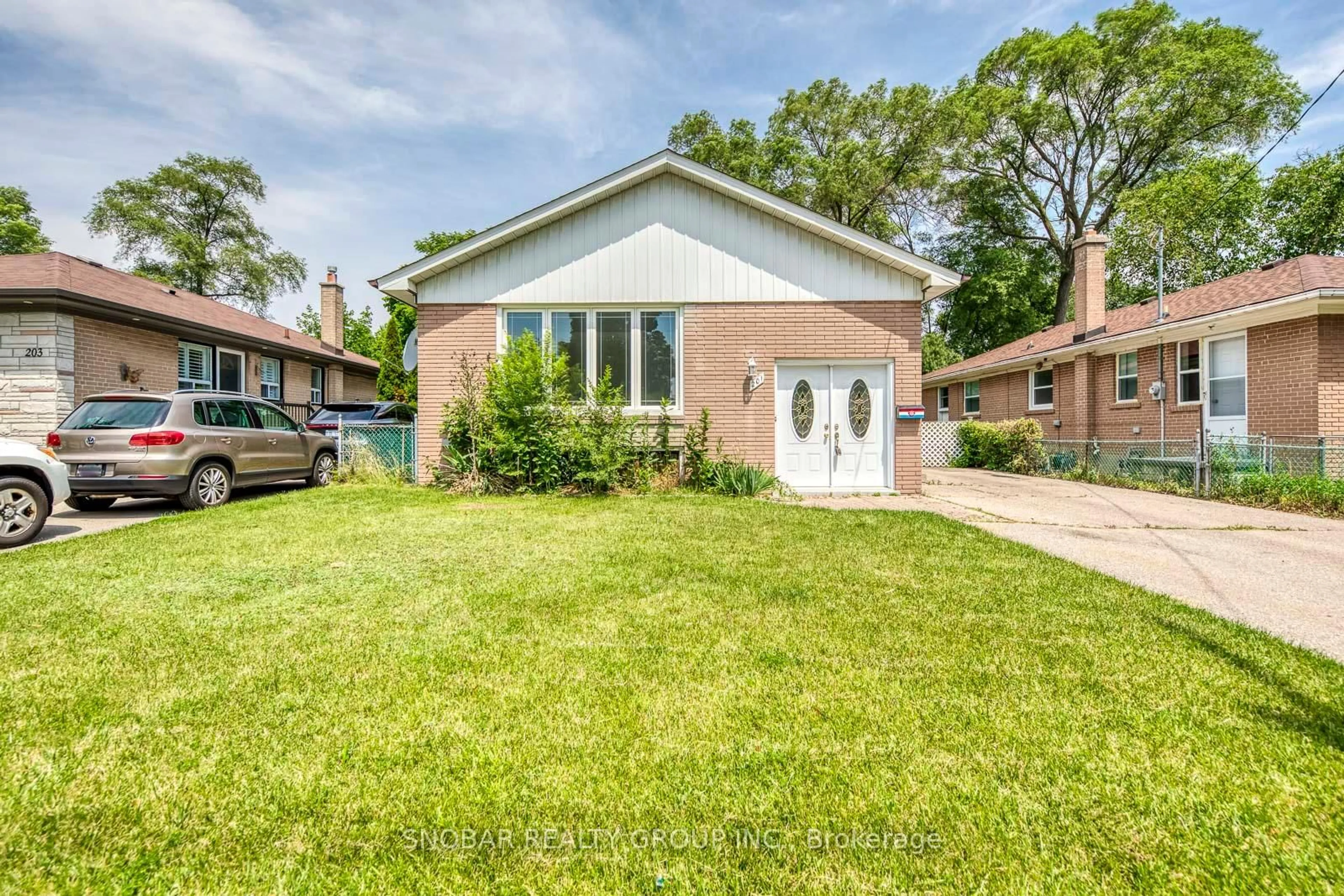 Home with brick exterior material, street for 201 Thistle Down Blvd, Toronto Ontario M9V 1K4