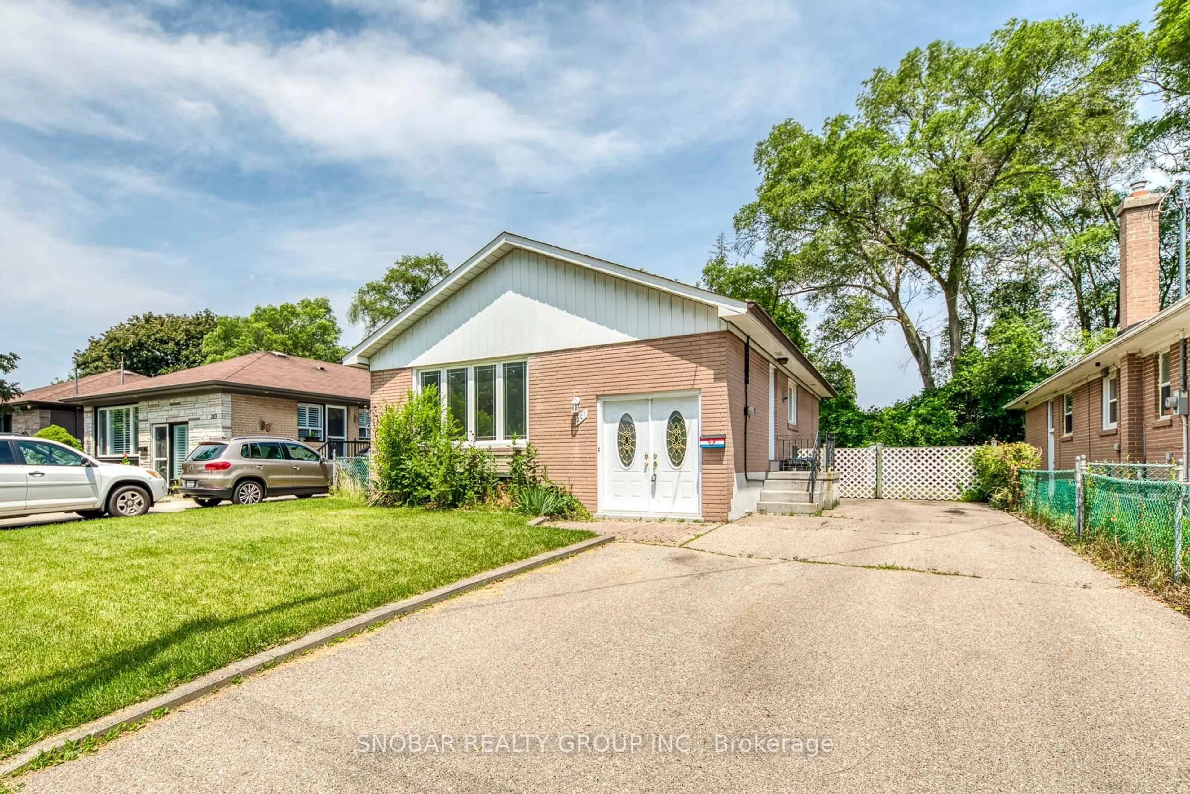 Home with brick exterior material, street for 201 Thistle Down Blvd, Toronto Ontario M9V 1K4