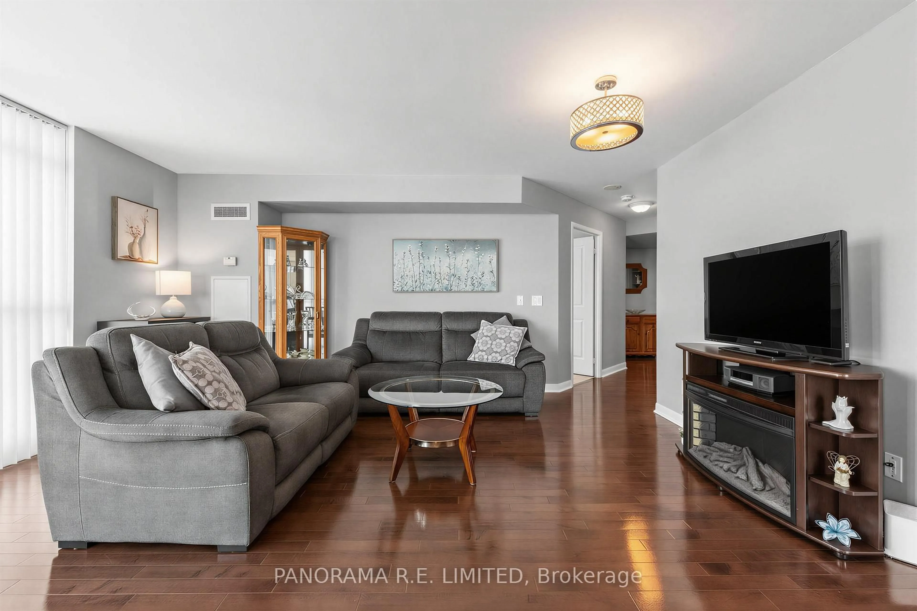Living room with furniture, wood/laminate floor for 235 Sherway Gardens Rd #1810, Toronto Ontario M9C 0A2