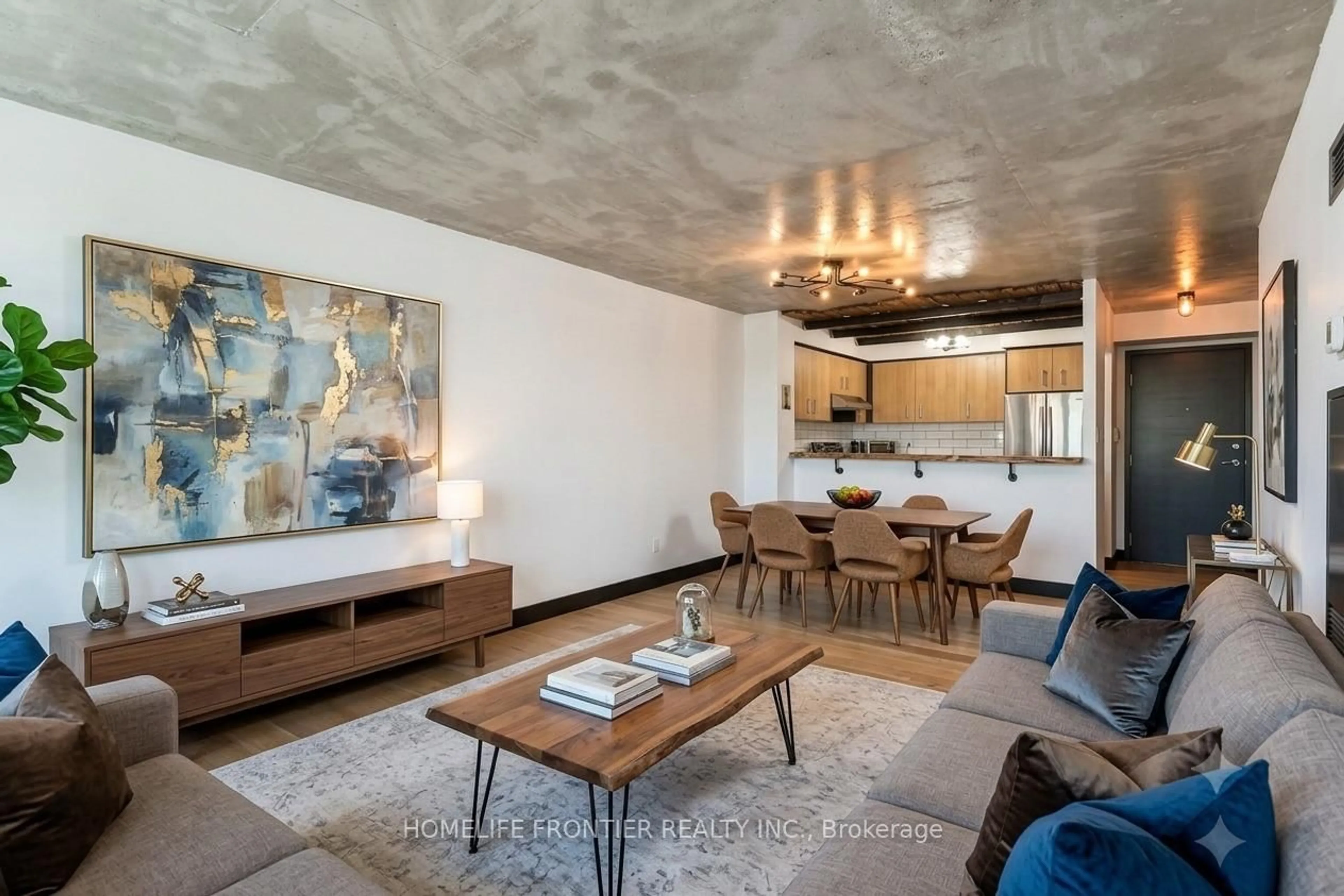 Living room with furniture, cement floor for 2261 Lakeshore Blvd #611, Toronto Ontario M8V 3X1