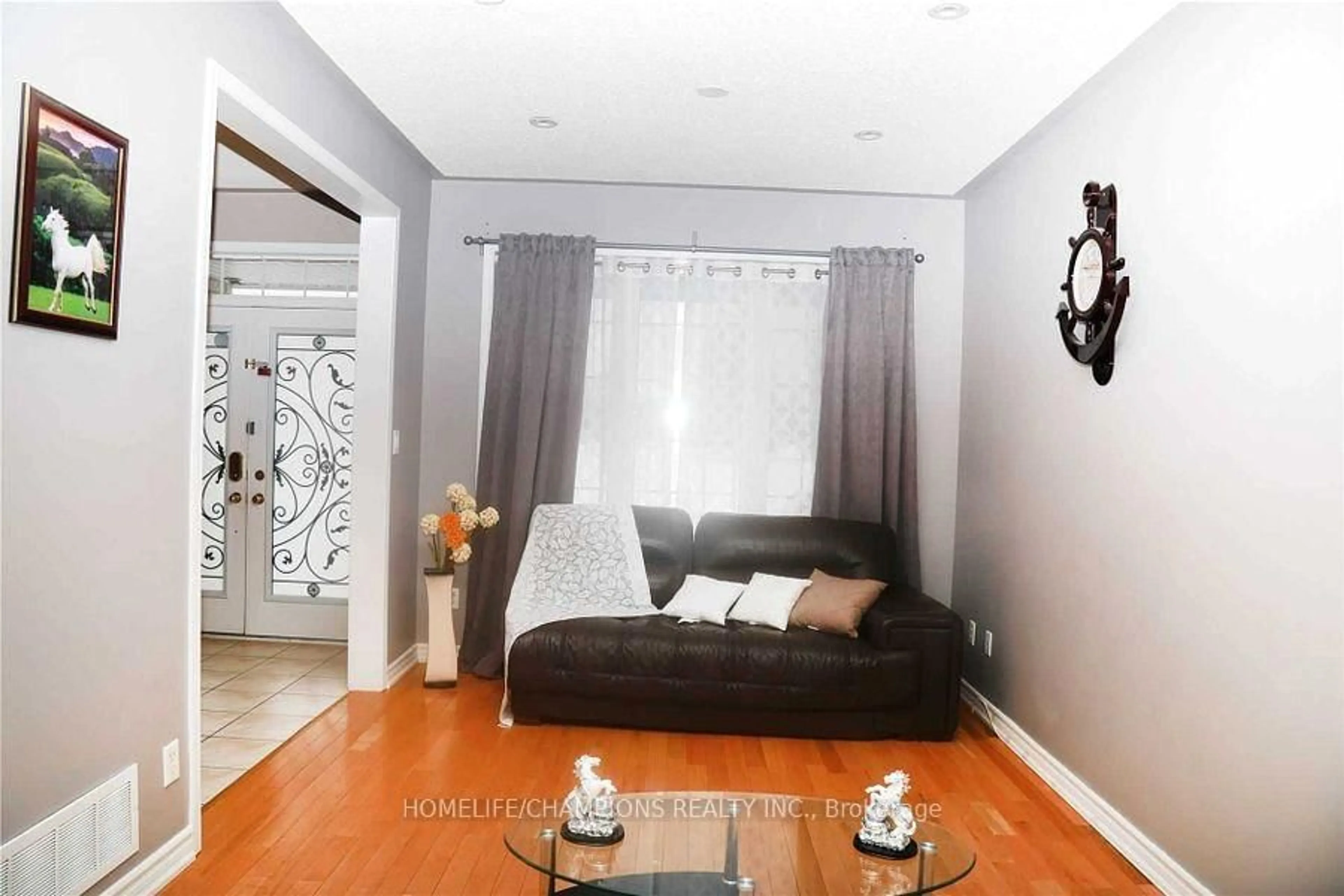 Living room with furniture, unknown for 14 Benmore Cres, Brampton Ontario L6P 2S8