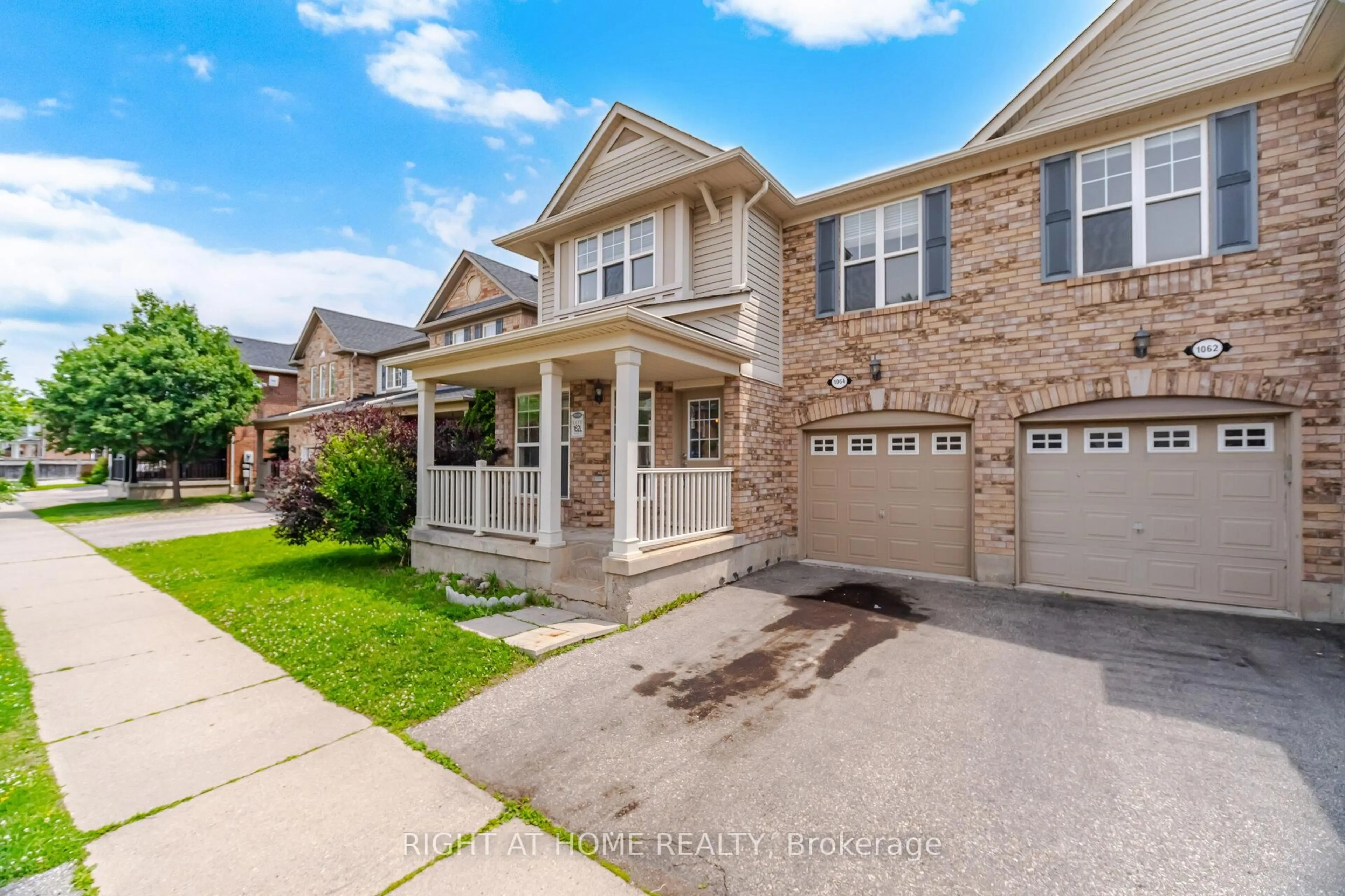 Home with brick exterior material, street for 1064 Wickson Way, Milton Ontario L9T 6Y4