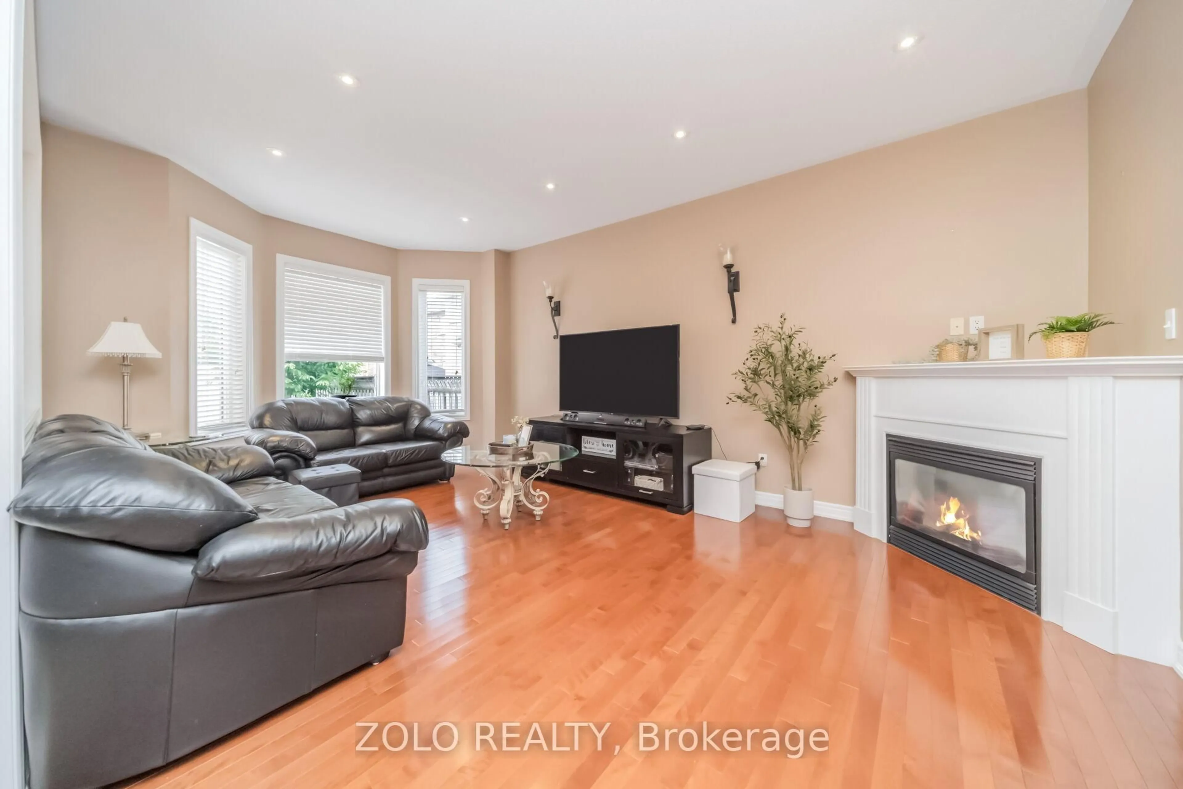 Living room with furniture, wood/laminate floor for 3 Tennant Dr, Brampton Ontario L6R 0E5