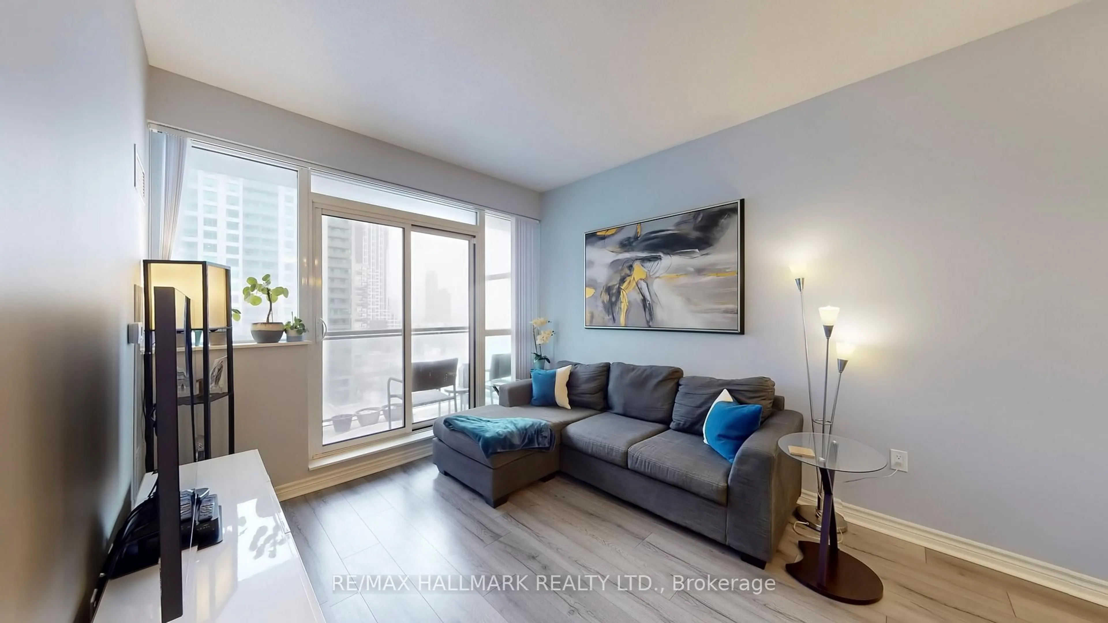 Living room with furniture, wood/laminate floor for 349 Rathburn Rd #910, Mississauga Ontario L5B 0G9