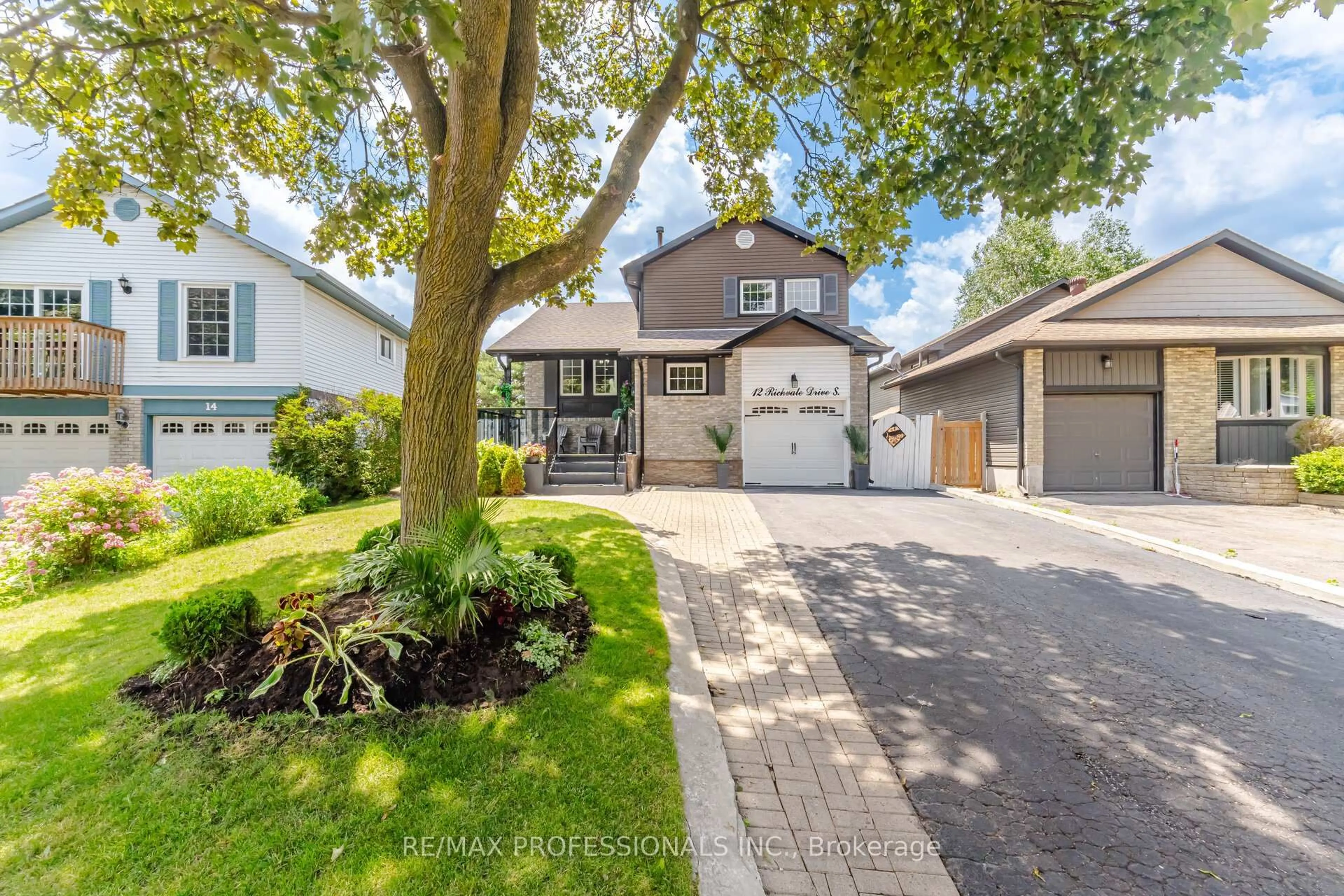 Home with vinyl exterior material, street for 12 Richvale Dr, Brampton Ontario L6Z 1M4