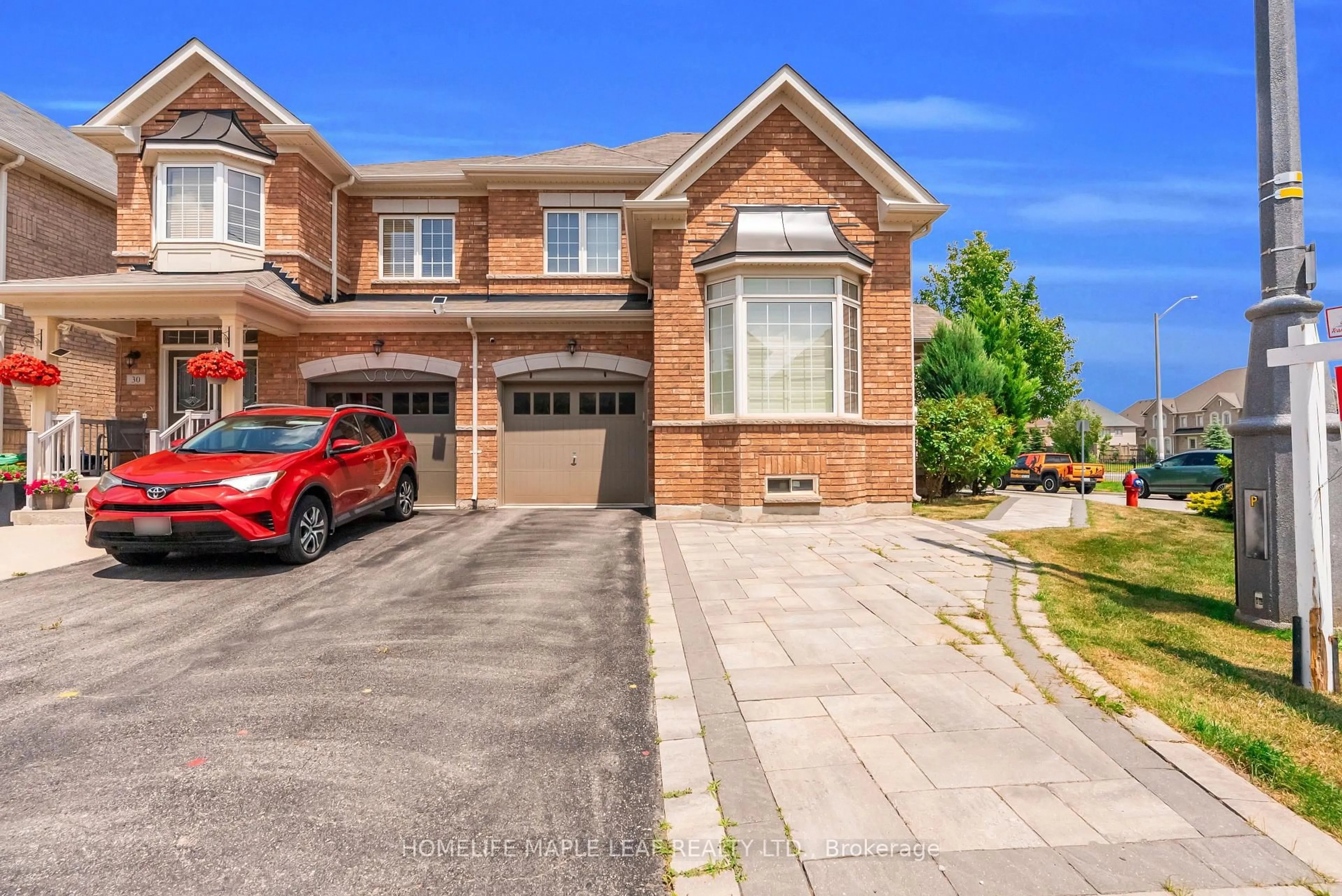 Home with brick exterior material, street for 32 Orangeblossom Tr, Brampton Ontario L6X 3B4