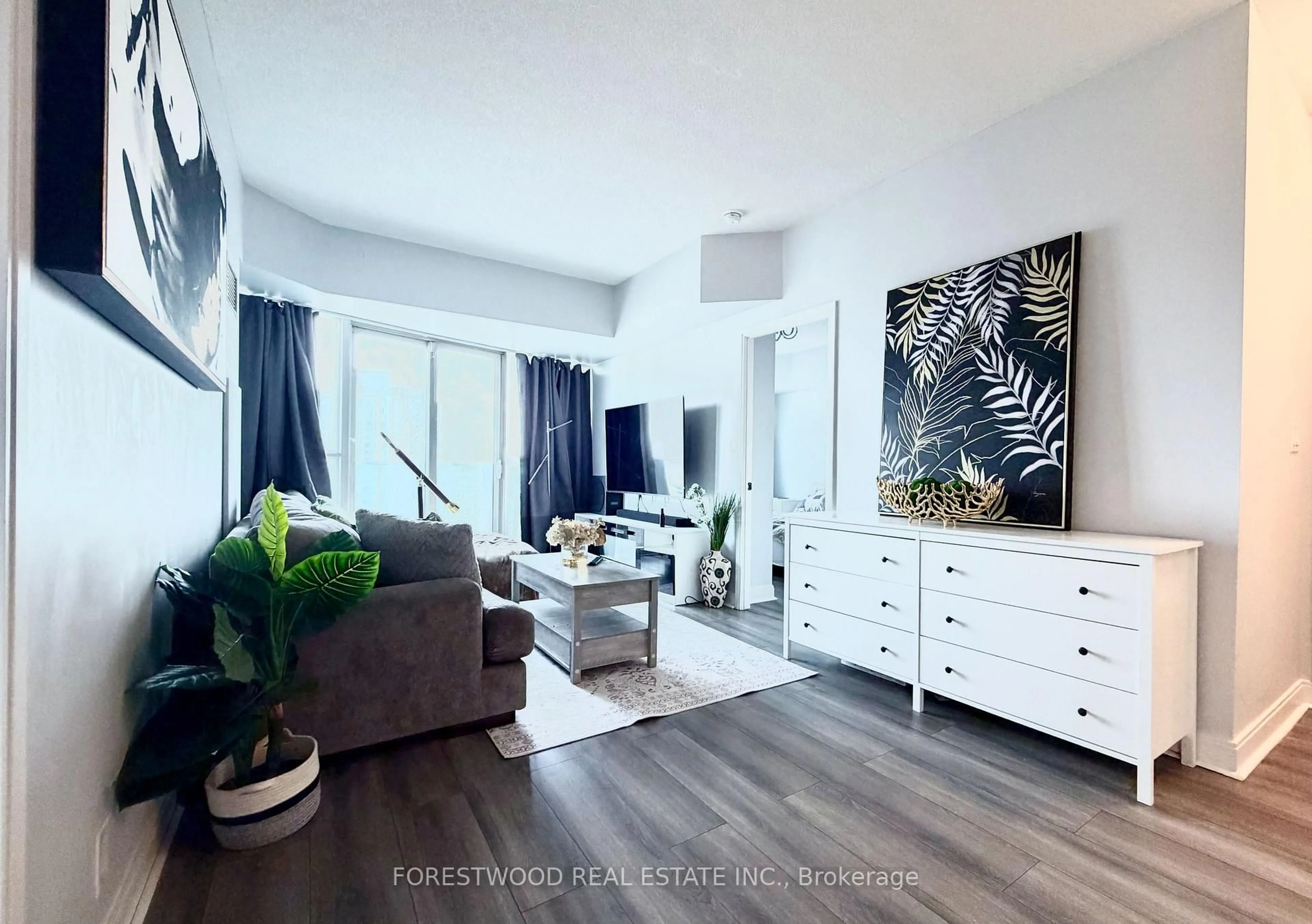 Living room with furniture, unknown for 60 Absolute Ave #2402, Mississauga Ontario L4Z 0A9