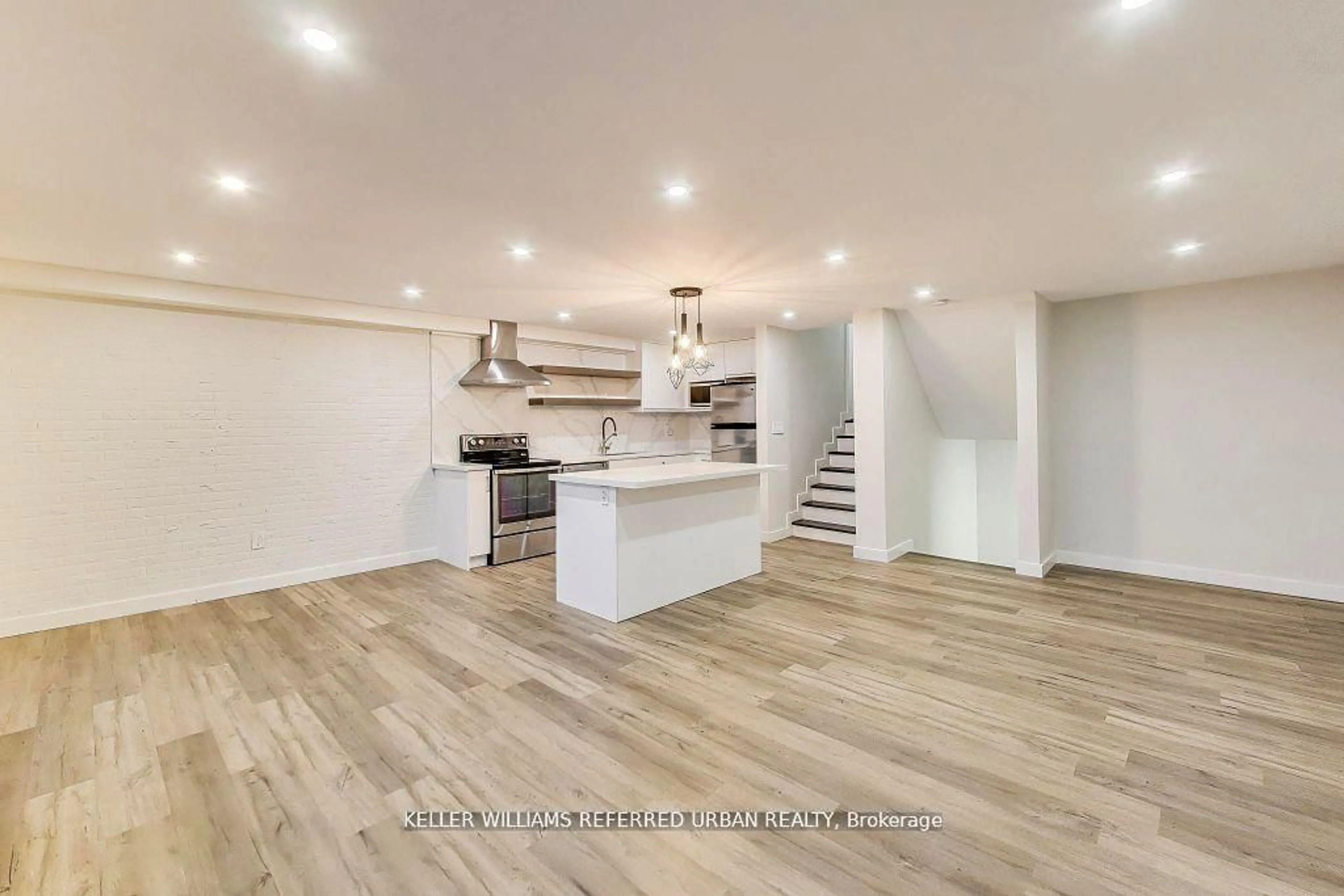 Open concept kitchen, wood/laminate floor for 11 Wincott Dr #1215, Toronto Ontario M9R 2R9