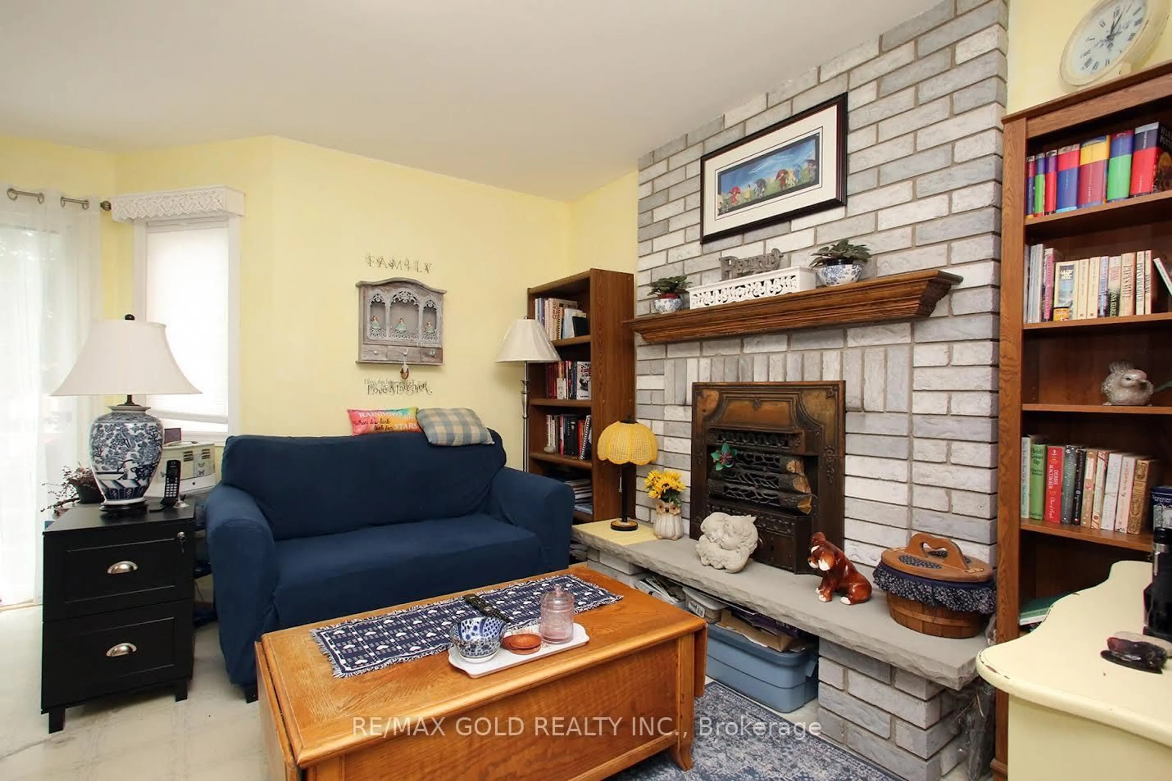 Living room with furniture, ceramic/tile floor for 65 Cheviot Cres, Brampton Ontario L6Z 4G9