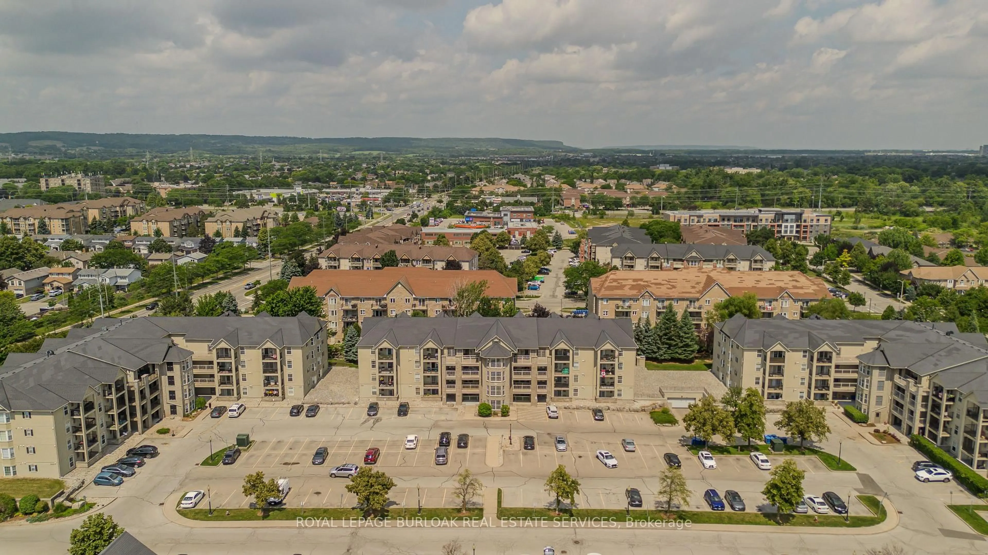 A pic from outside/outdoor area/front of a property/back of a property/a pic from drone, city buildings view from balcony for 1441 Walker's Line #306, Burlington Ontario L7M 4P2
