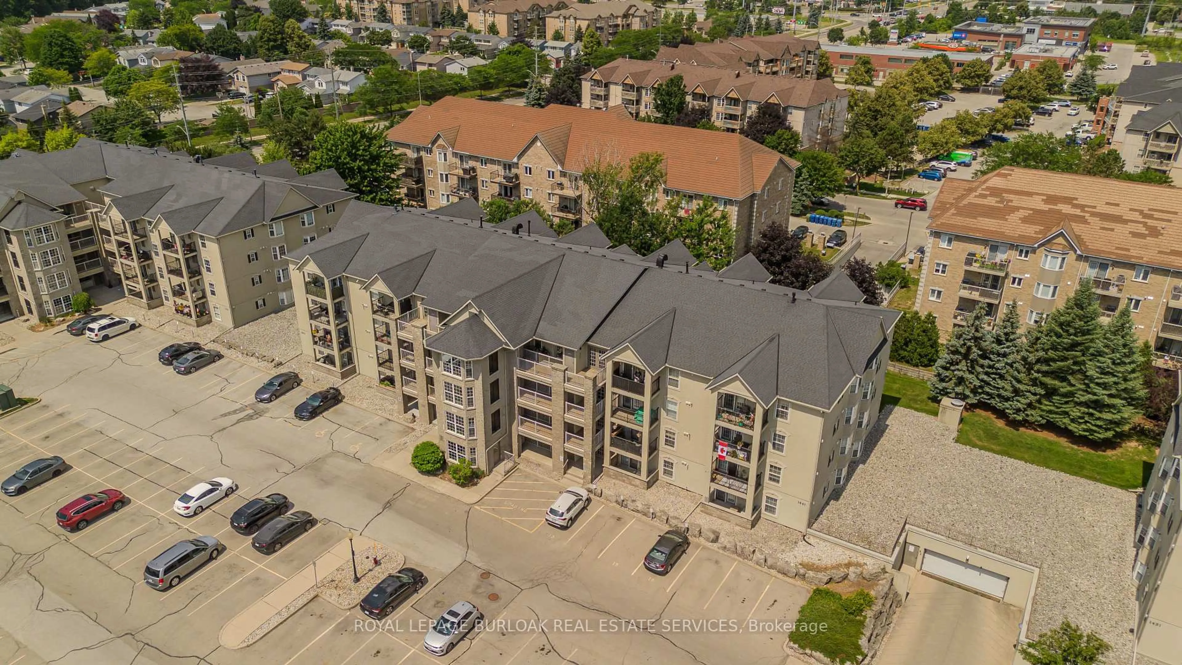 A pic from outside/outdoor area/front of a property/back of a property/a pic from drone, city buildings view from balcony for 1441 Walker's Line #306, Burlington Ontario L7M 4P2