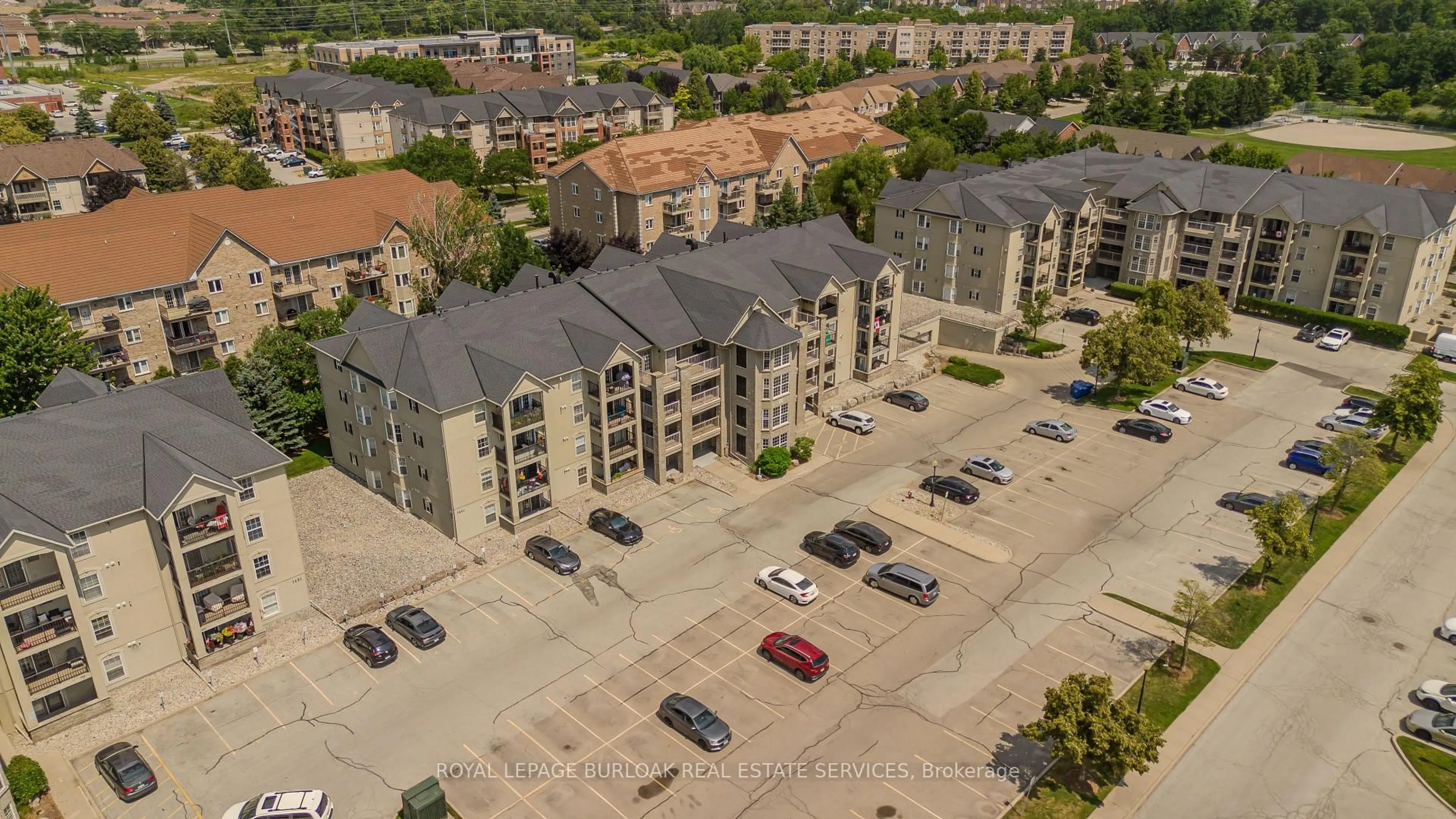A pic from outside/outdoor area/front of a property/back of a property/a pic from drone, city buildings view from balcony for 1441 Walker's Line #306, Burlington Ontario L7M 4P2