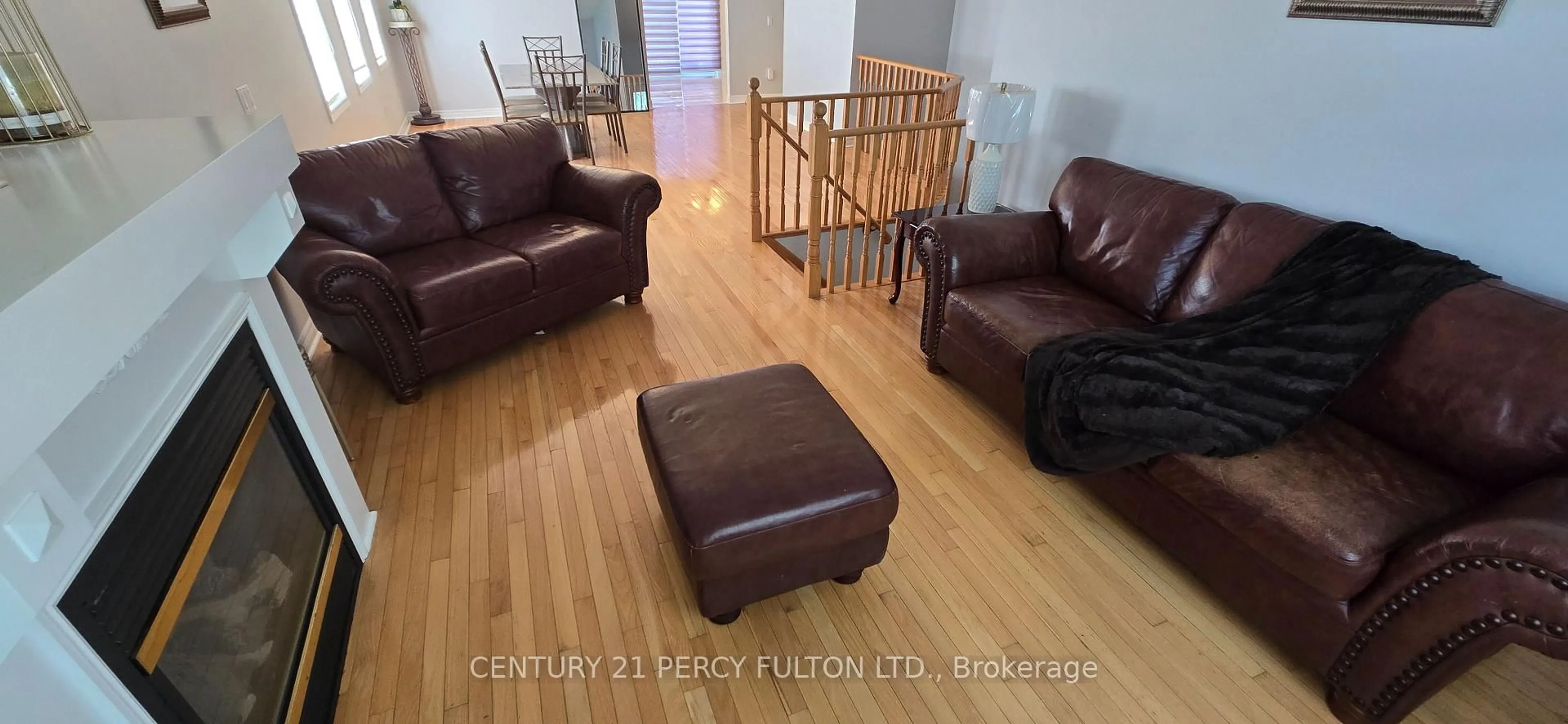 Living room with furniture, wood/laminate floor for 26 Rushbrook Dr, Brampton Ontario L6P 1E4
