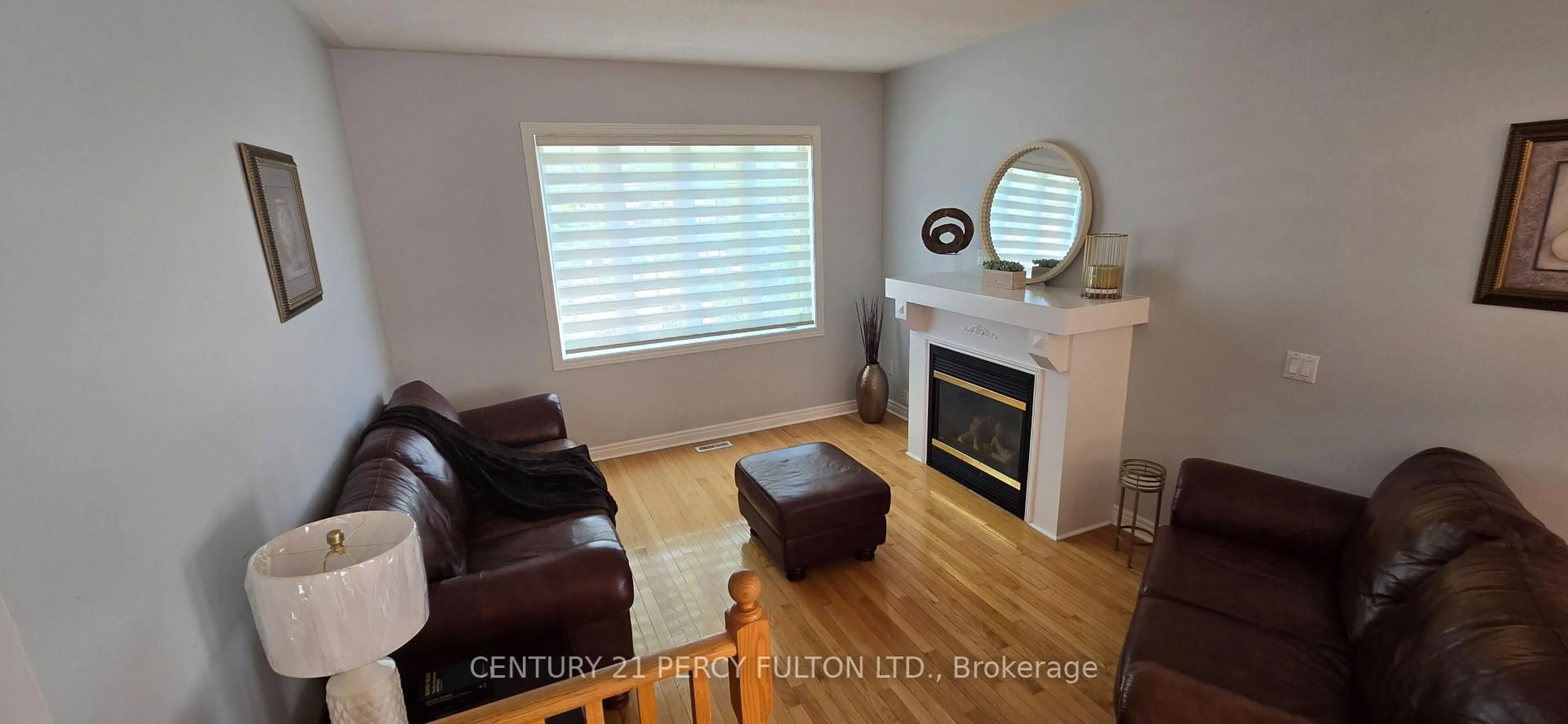 Living room with furniture, wood/laminate floor for 26 Rushbrook Dr, Brampton Ontario L6P 1E4