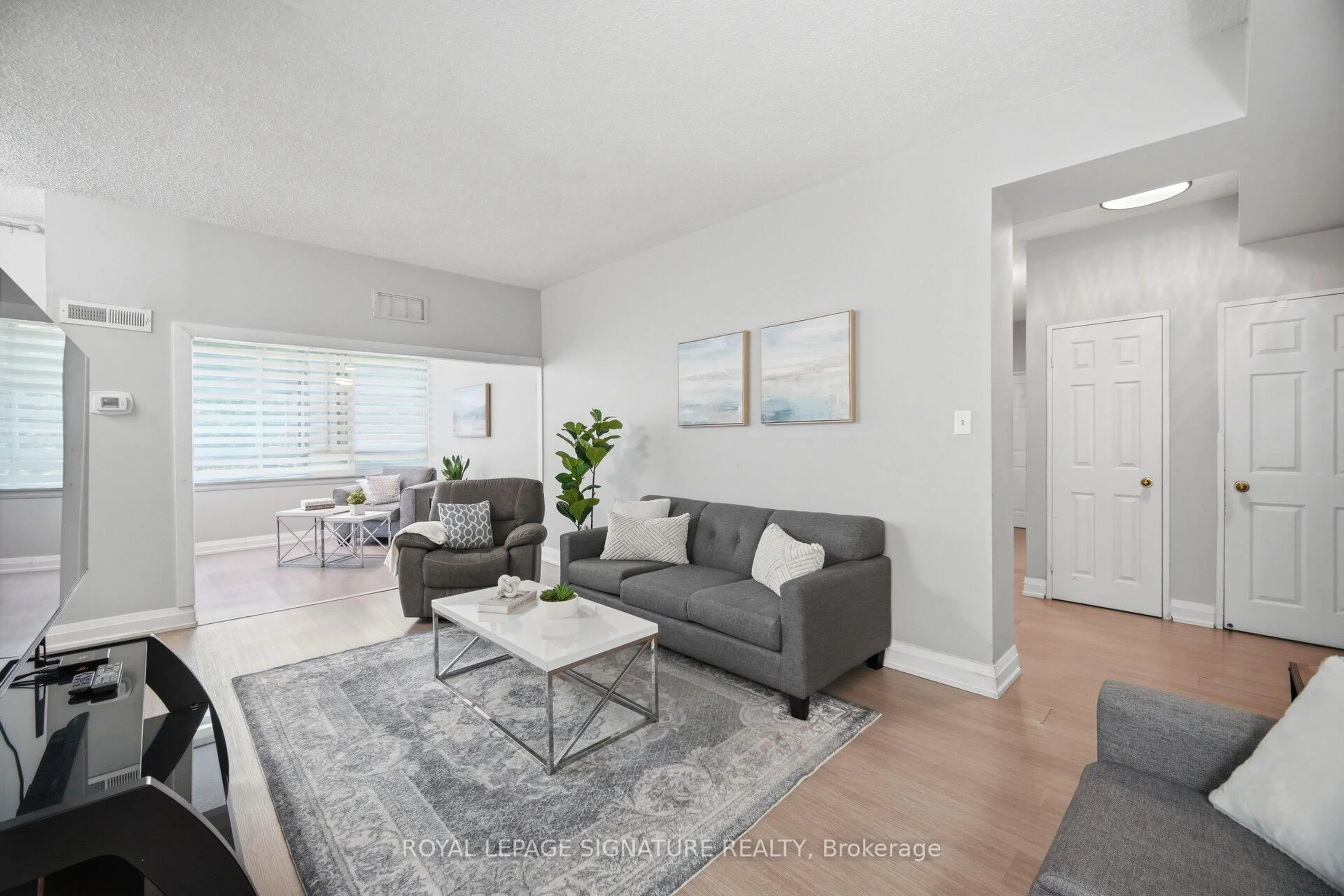 Living room with furniture, unknown for 5 Lisa St #109, Brampton Ontario L6T 4T4