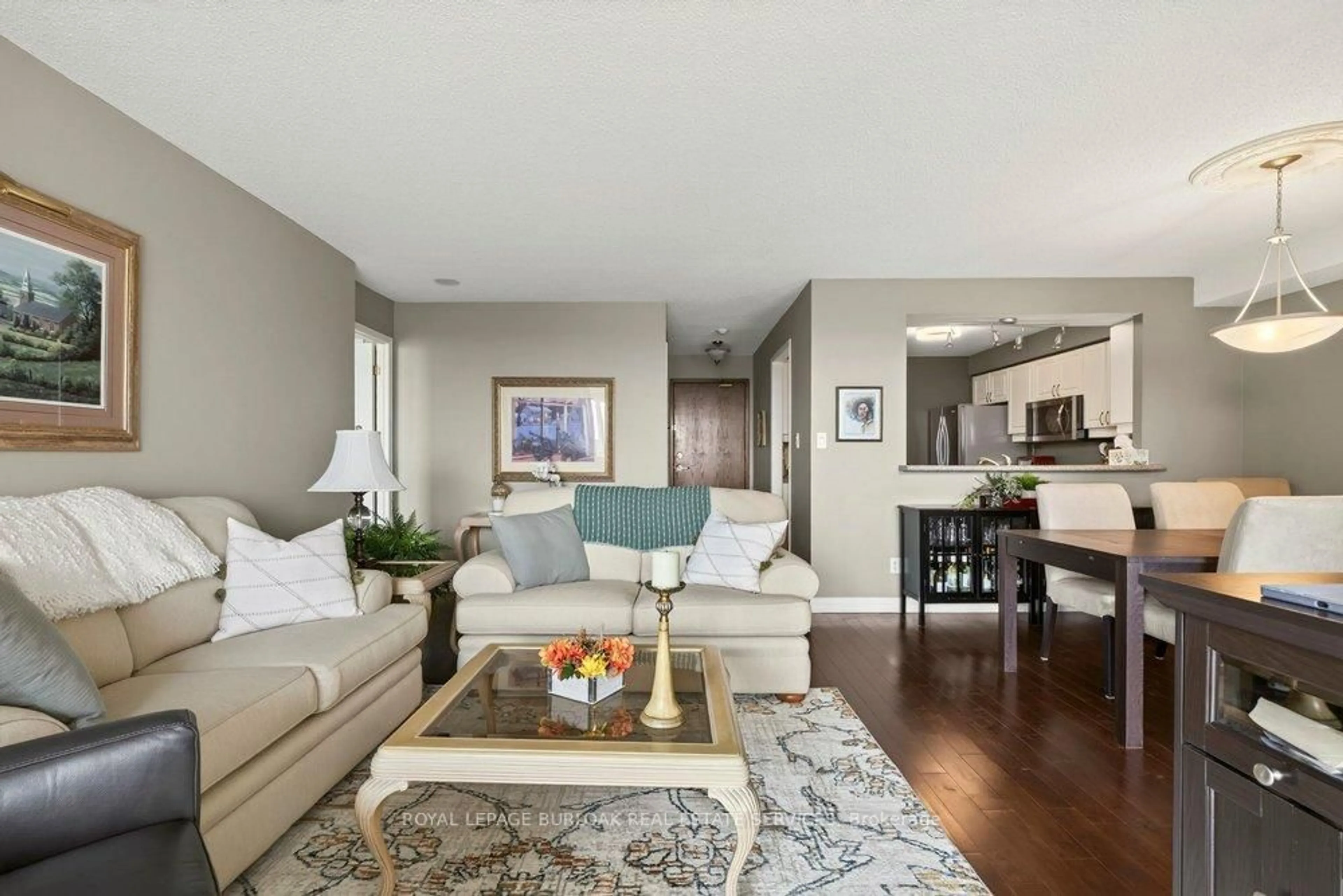 Living room with furniture, wood/laminate floor for 1276 Maple Crossing Blvd #1406, Burlington Ontario L7S 2J9