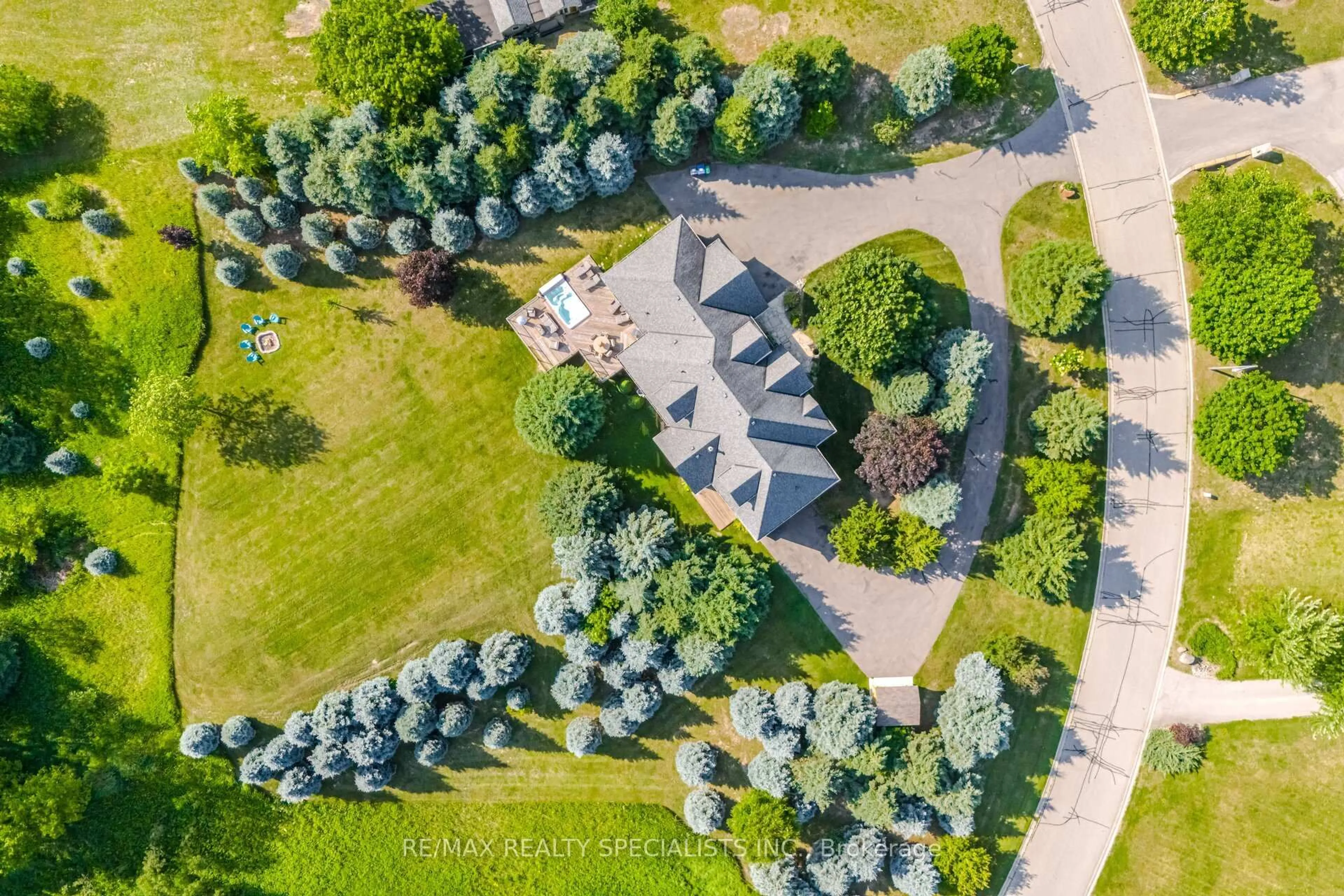 A pic from outside/outdoor area/front of a property/back of a property/a pic from drone, forest/trees view for 4 Tranquility Crt, Caledon Ontario L7E 3R7